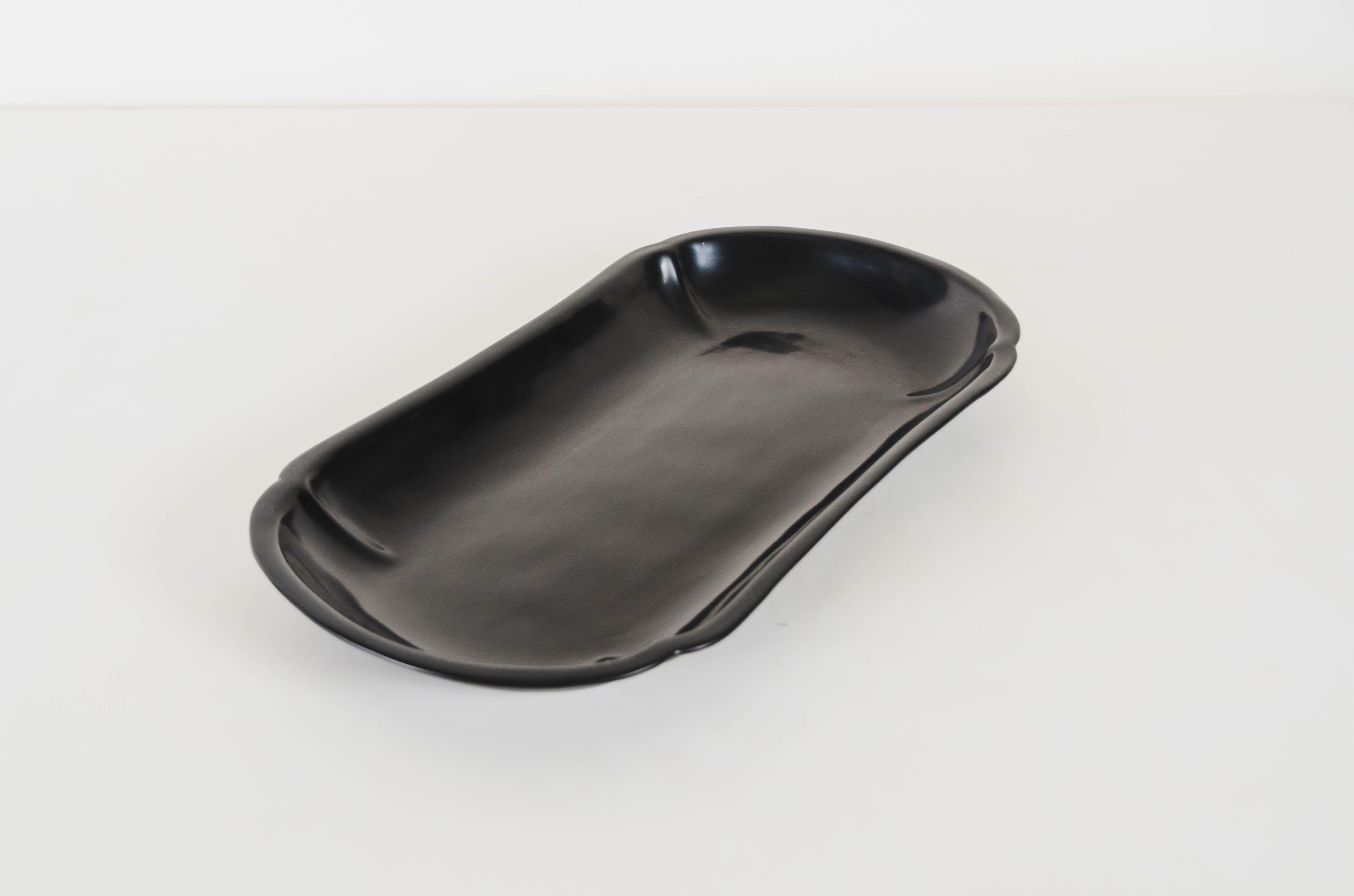 4 lobed oblong oval tray
Black lacquer
Hand made
Limited edition
Lacquer is a technique that dates back to the Shang dynasty, circa 1600-1100 B.C. These pieces are made with at least 60 coats of organic lacquer. Each layer of lacquer is applied