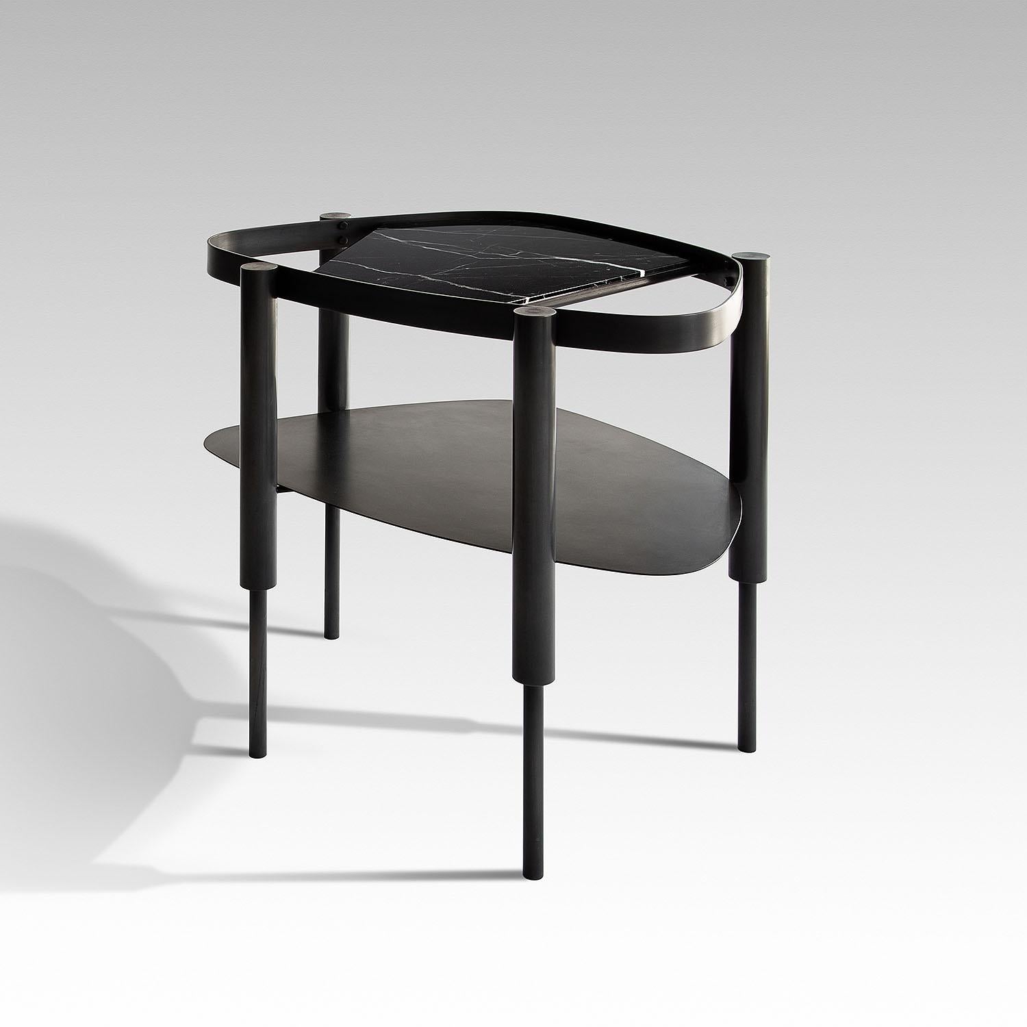 Contemporary black marble & steel side table - Bijou Black by Adam Court for Okha

Design: Adam Court

Material: patinated blue black mild steel frame clear / grey / bronze glass insert / marble insert options

Dimensions:
610W X 450D X 580H