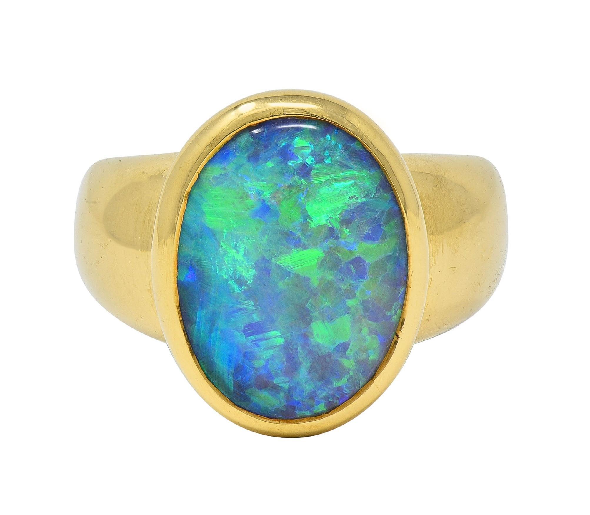 Contemporary Black Opal 18 Karat Yellow Gold Puffed Bezel Gemstone Ring For Sale
