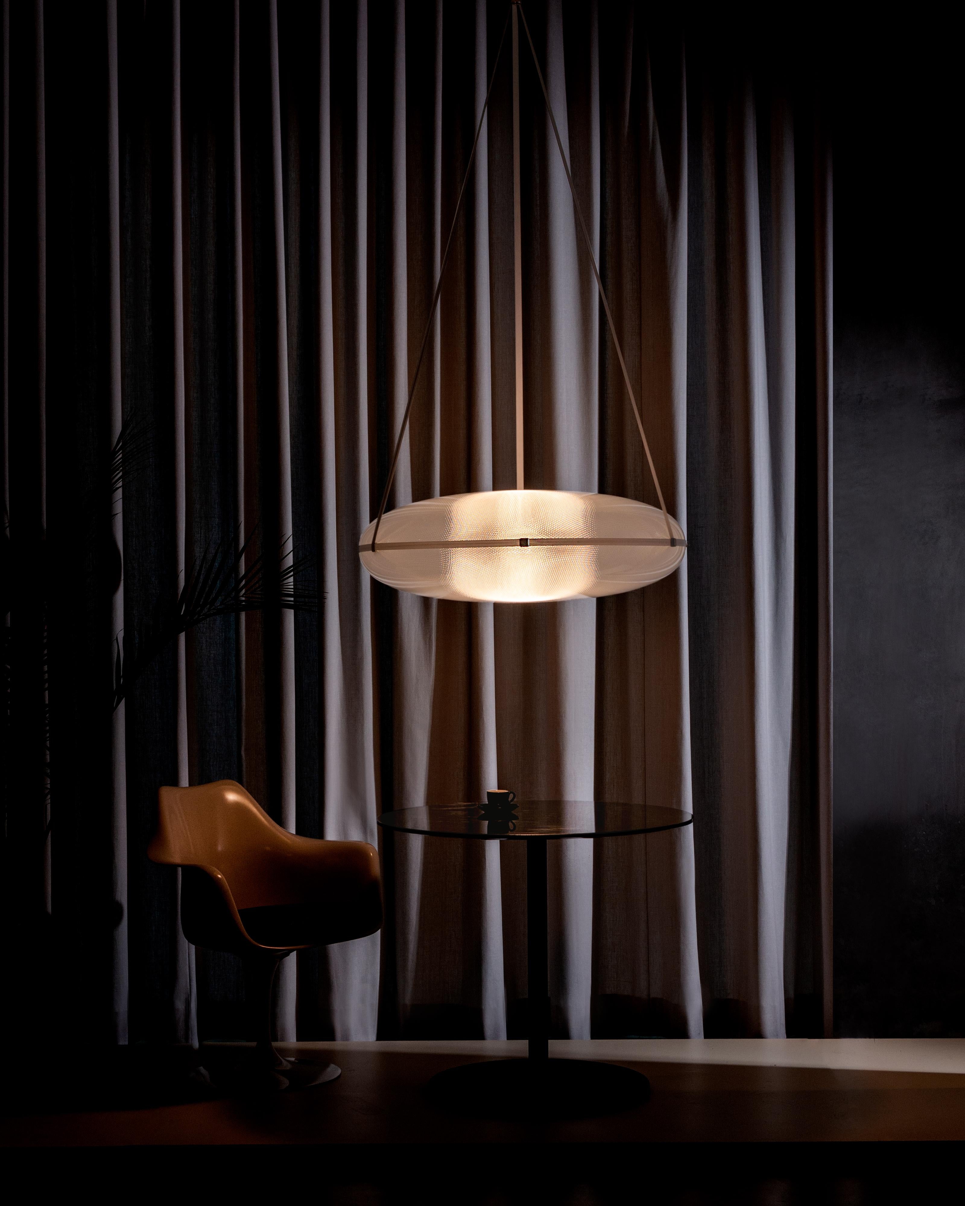 Contemporary pendant lamp 'Iris'

Electrical : 
Voltage: 120 V – 277 V 
Lamp: Integral 34 W 35 V DC LED

The model shown in picture:
- Diameter: 90 cm Height. 30 cm 
- Finish: Black
- Wire height: 300 cm
- Modules : B and B
______
IRIS
A