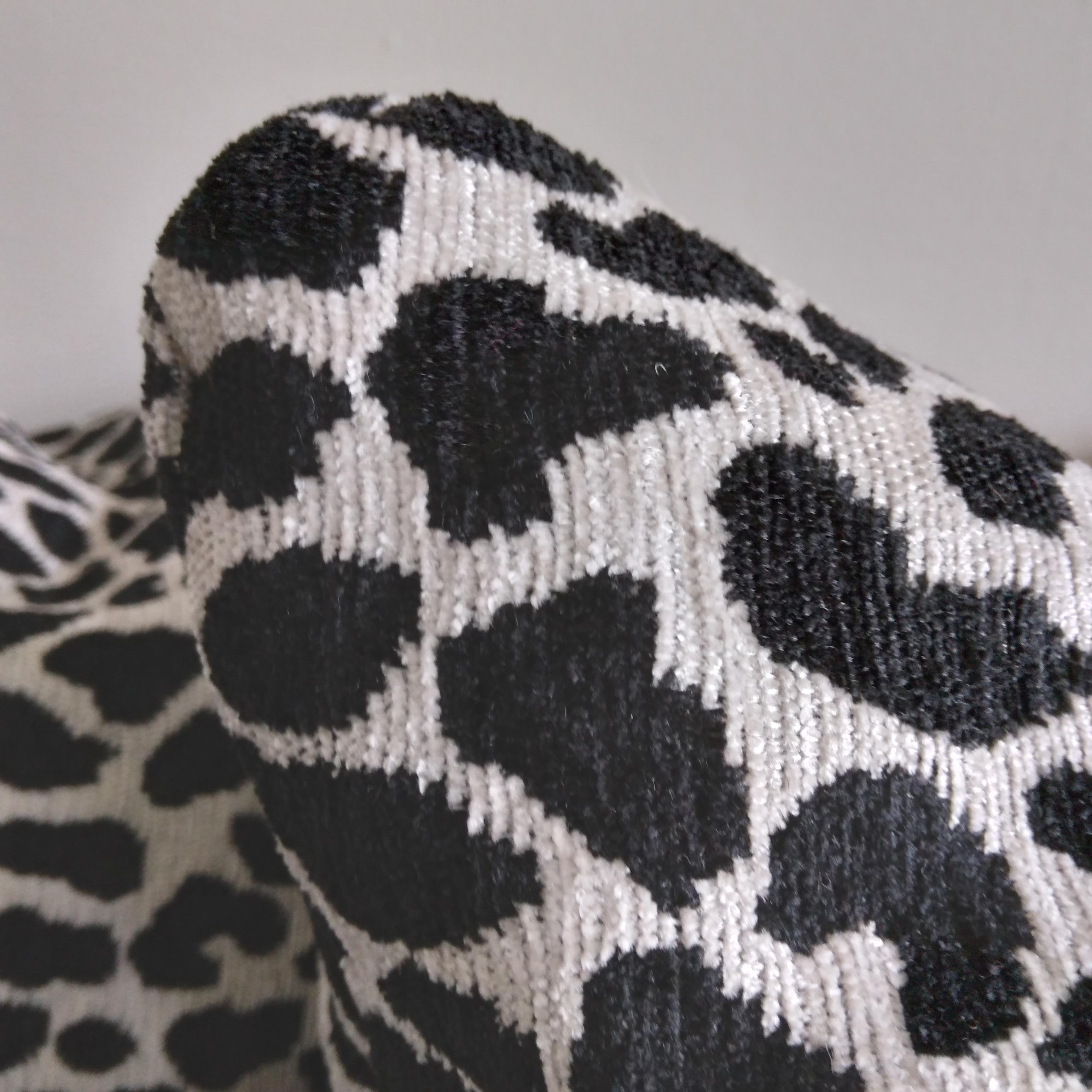Bring a playful edge into your living spaces with these gorgeous accent pillows. We love the safari-inspired cheetah pattern and the lovely woven chenille texture. Classic black pairs with nearly-white silver in a sharp and eye-catching pattern. The