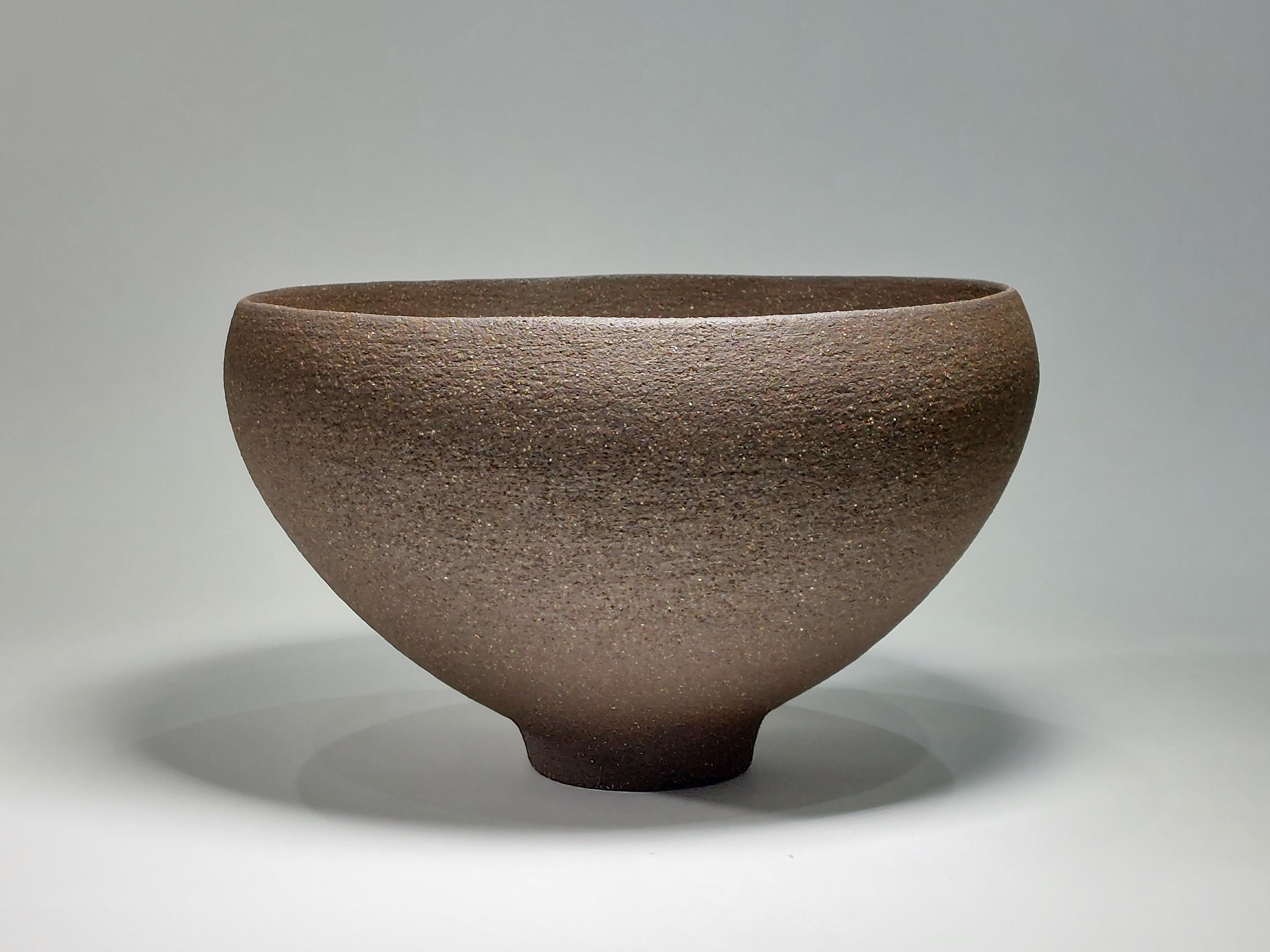 Contemporary Black Stoneware Ceramic Bowl by Rachel Peters, Unglazed, In Stock.

This bowl has been hand built from medium textured Vulcan Black Stoneware Clay using the traditional method of coiling.   Refined and finished by hand to create a