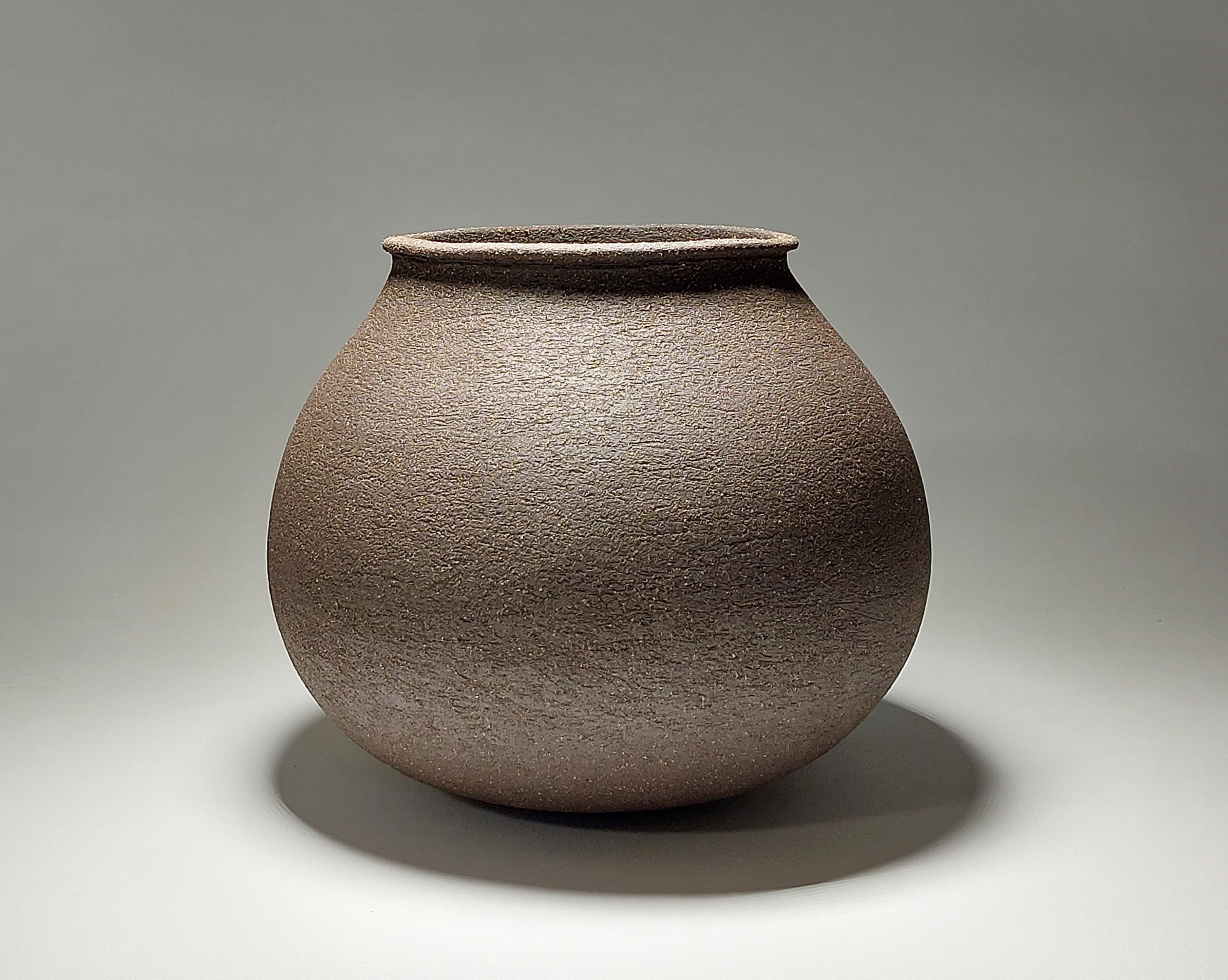 Contemporary Black Stoneware Ceramic Vessel by Rachel Peters, In Stock.

This vessel has been hand built from Course Vulcan Black Stoneware Clay using the traditional method of coiling.   Refined and finished by hand to create a beautiful tactile