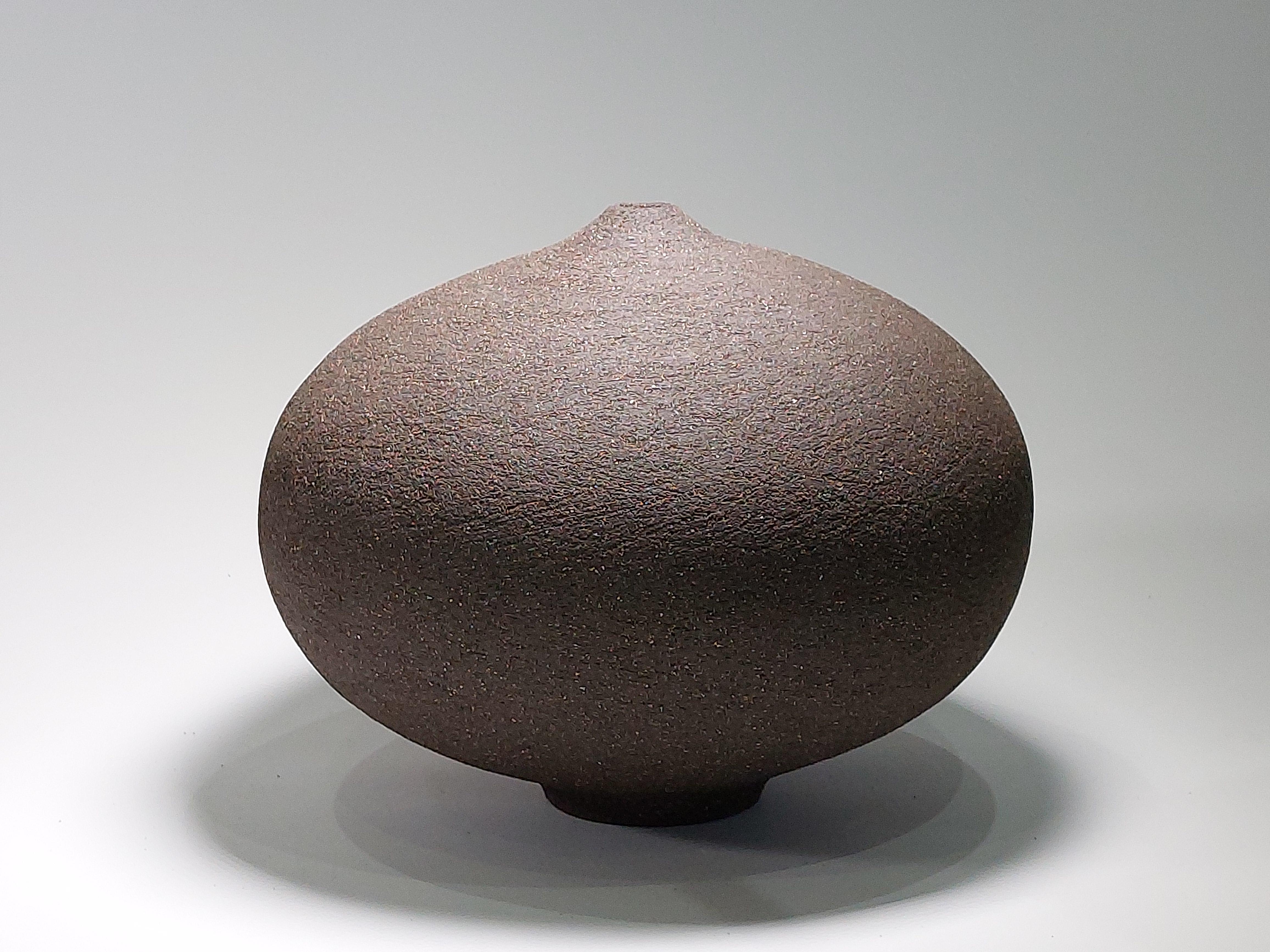 Contemporary Black Stoneware Ceramic Vessel by Rachel Peters, Medium, In Stock.

This vessel has been hand built from medium textured Vulcan Black Stoneware Clay using the traditional method of coiling.   Refined and finished by hand to create a