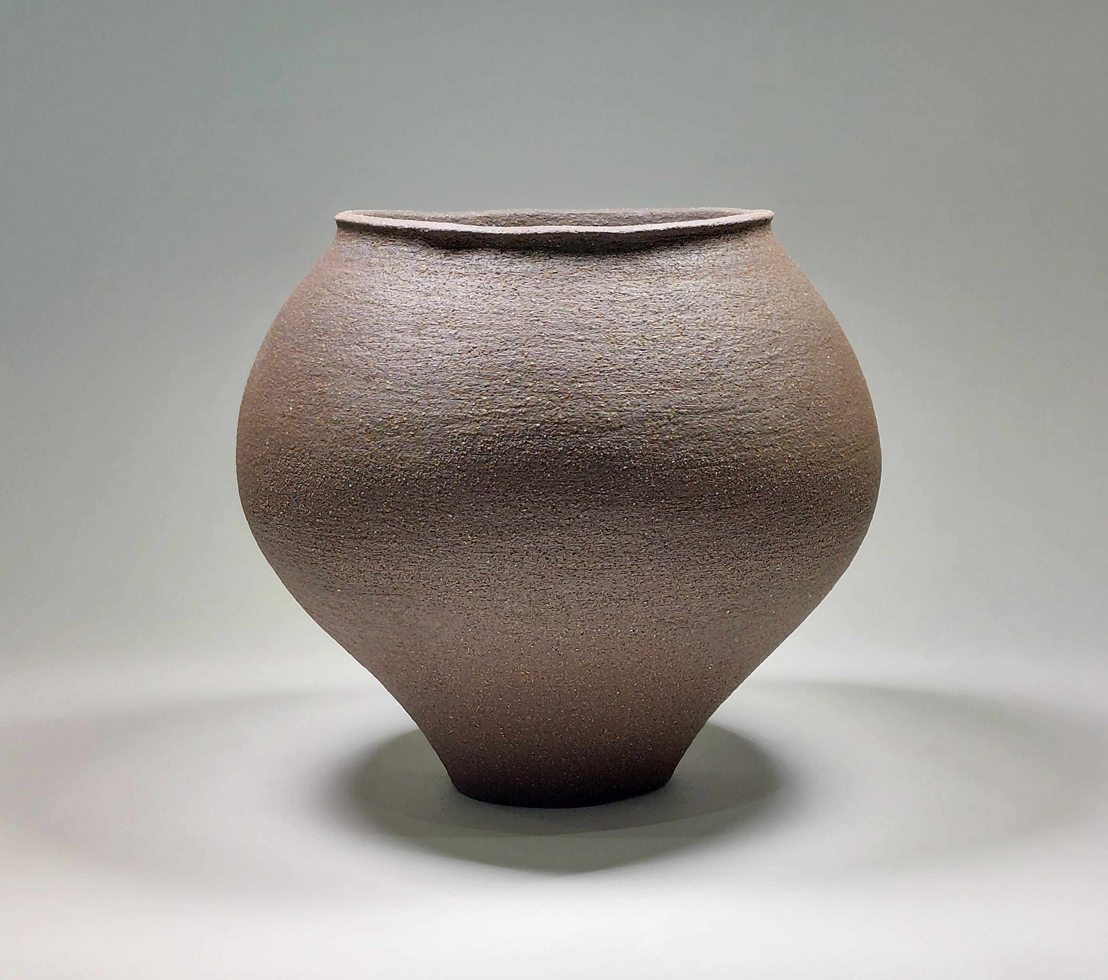 Contemporary Black Stoneware Ceramic Vessel by Rachel Peters, Short, In Stock.

This vessel has been hand built from medium textured Vulcan Black Stoneware Clay using the traditional method of coiling.   Refined and finished by hand to create a
