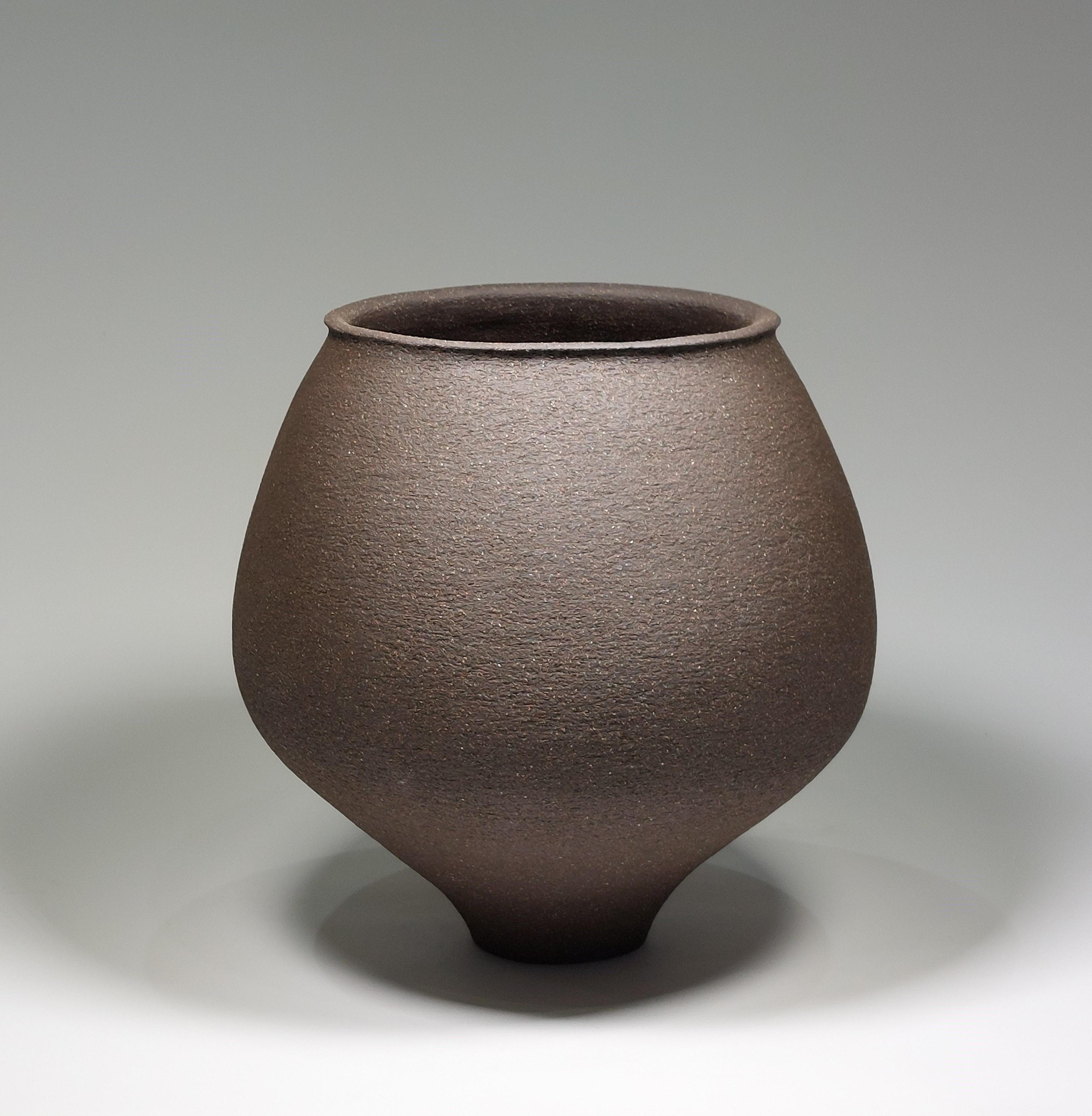 Contemporary Black Stoneware Ceramic Vessel by Rachel Peters, Tall, In Stock.

This vessel has been hand built from Course Vulcan Black Stoneware Clay using the traditional method of coiling.   Refined and finished by hand to create a beautiful