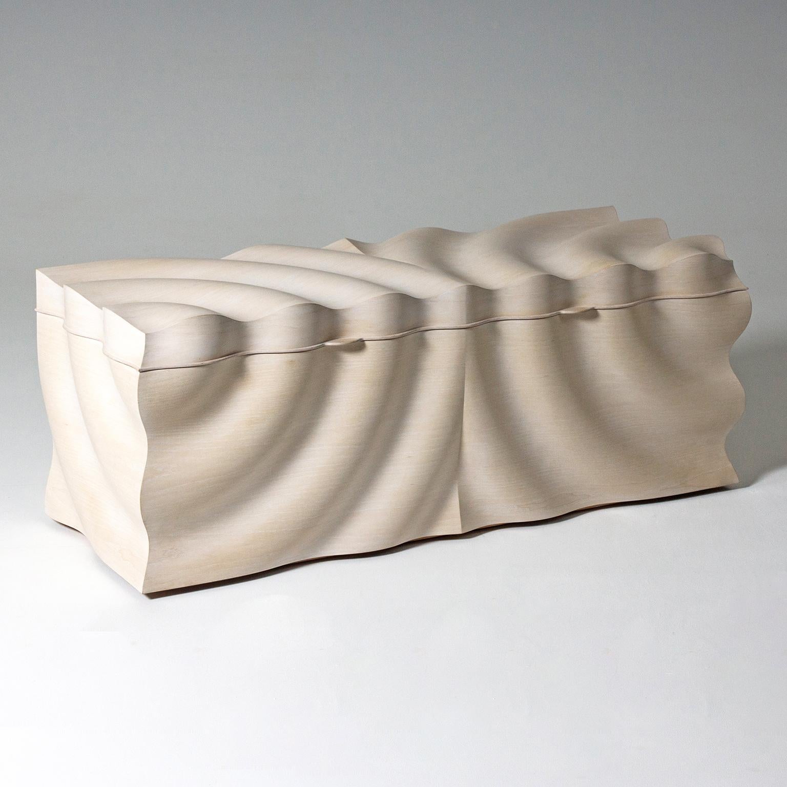 The contemporary rippled 'Reflection' blanket chest by Edward Johnson forms part of his Ripples collection. Inspired by the action of a stone dropping into water, the principal intention was to produce a surface that could replicate the fluidity of