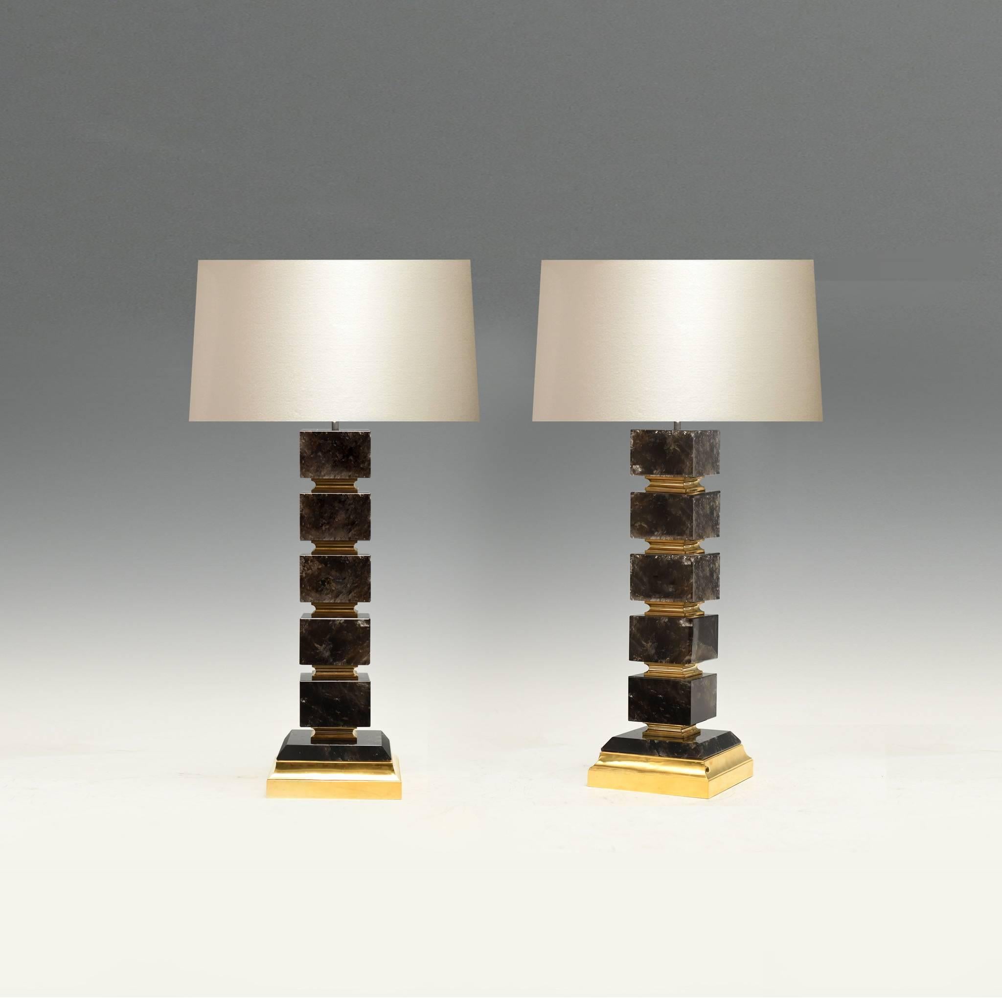 A pair of fine block form dark rock crystal quartz lamp with polish brass insert and base, created by Phoenix Gallery, NYC.
Available in nickel plating and antique brass finished. 
To the rock crystal: 20 inch/H.
(Lampshade not included).
