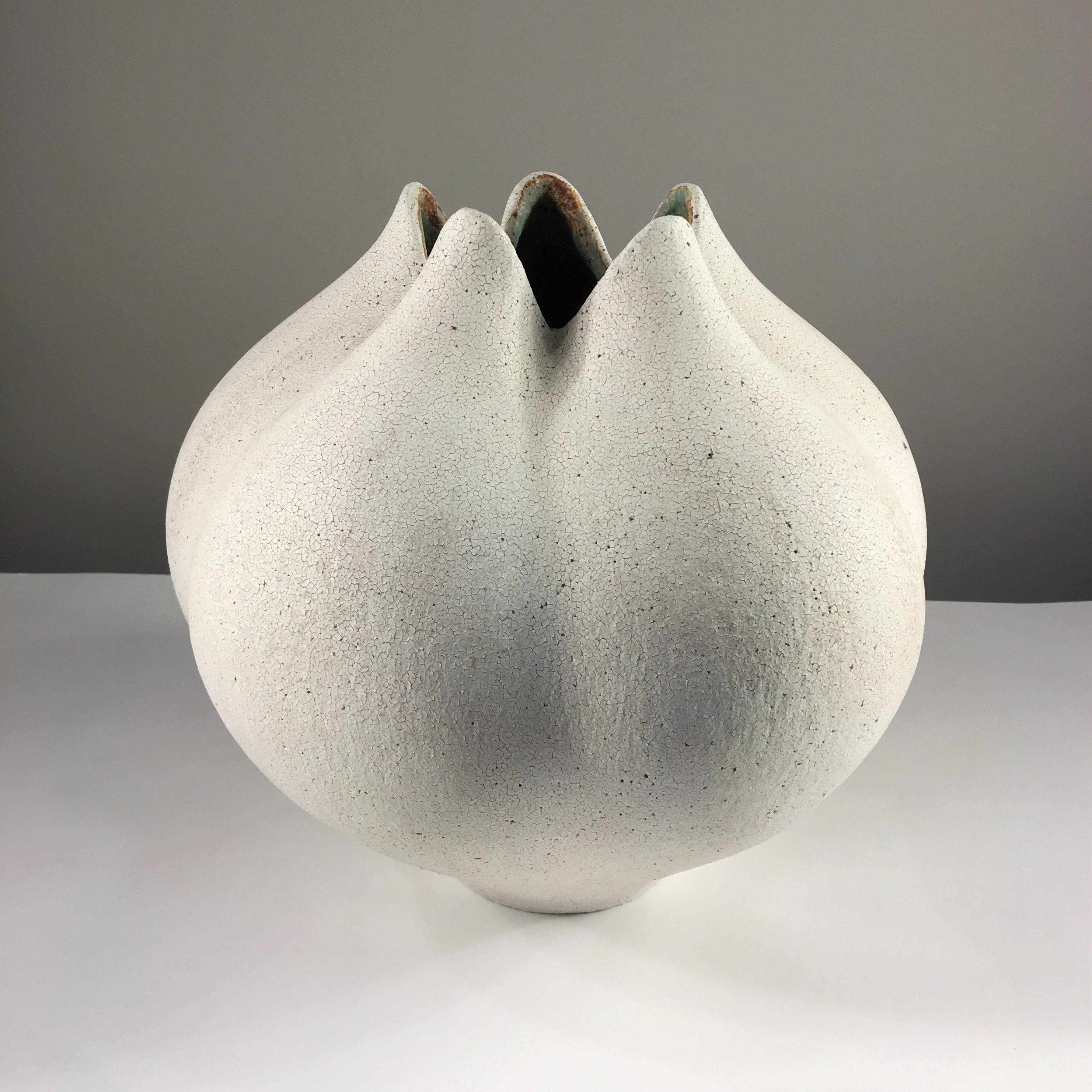 Contemporary ceramic artist Yumiko Kuga's glazed stoneware blossom vase no. 143 is part of her Crackle Series. All of the pieces in this series are hand-built and 100% handmade so they are one-of-a-kind and thus vary slightly from one another. All