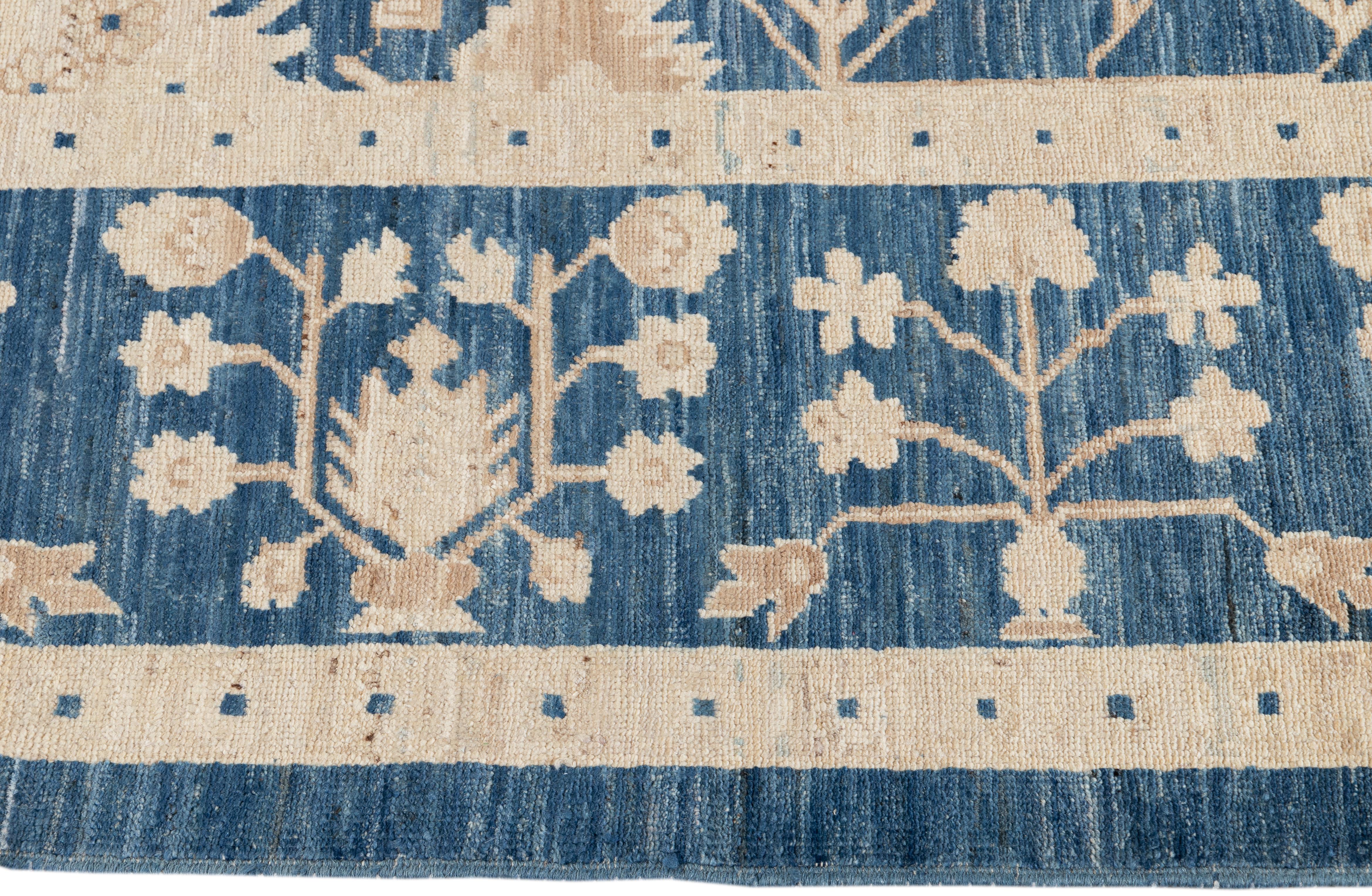 Pakistani Contemporary Blue and Ivory Oushak-Style Wool Area Rug
