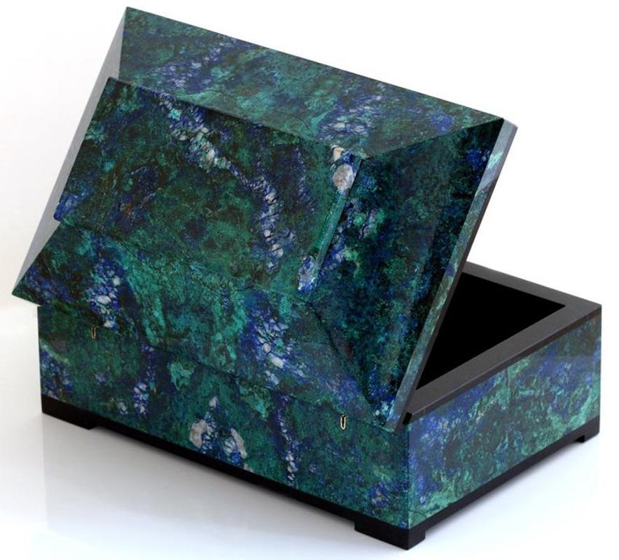 Invite healing energy into your home with an exquisite blue green azurite malachite box. This box is beautifully made with a hinged lid and expert construction. Lined in black velvet with black marble trims. Finished to a high polish to show off the