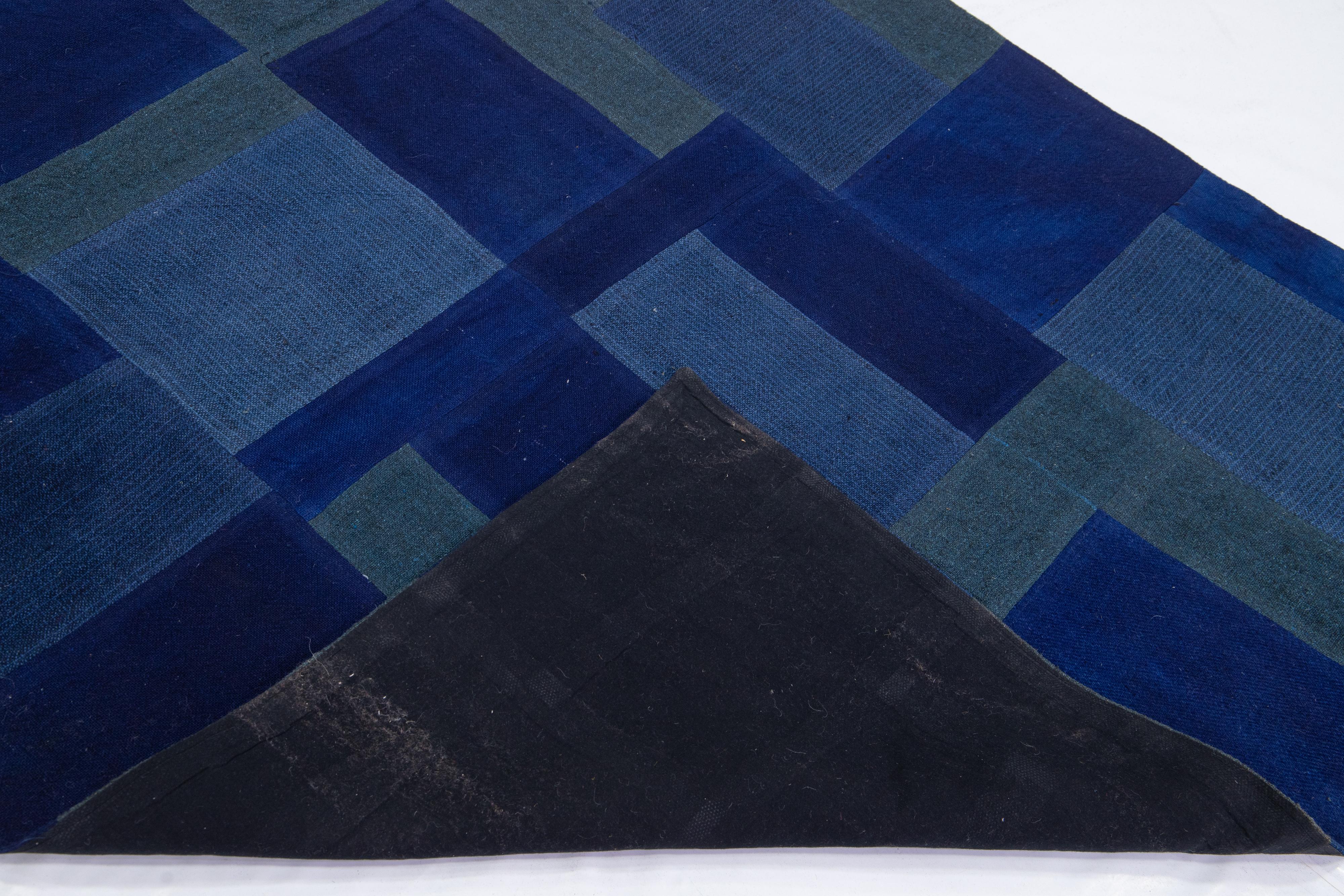 Modern Indian flat-weave rug featuring an all-over blue geometric design. This piece showcases intricate details, vibrant colors, and a stunning design. It would make a perfect addition to your home.

This rug measures 4'7