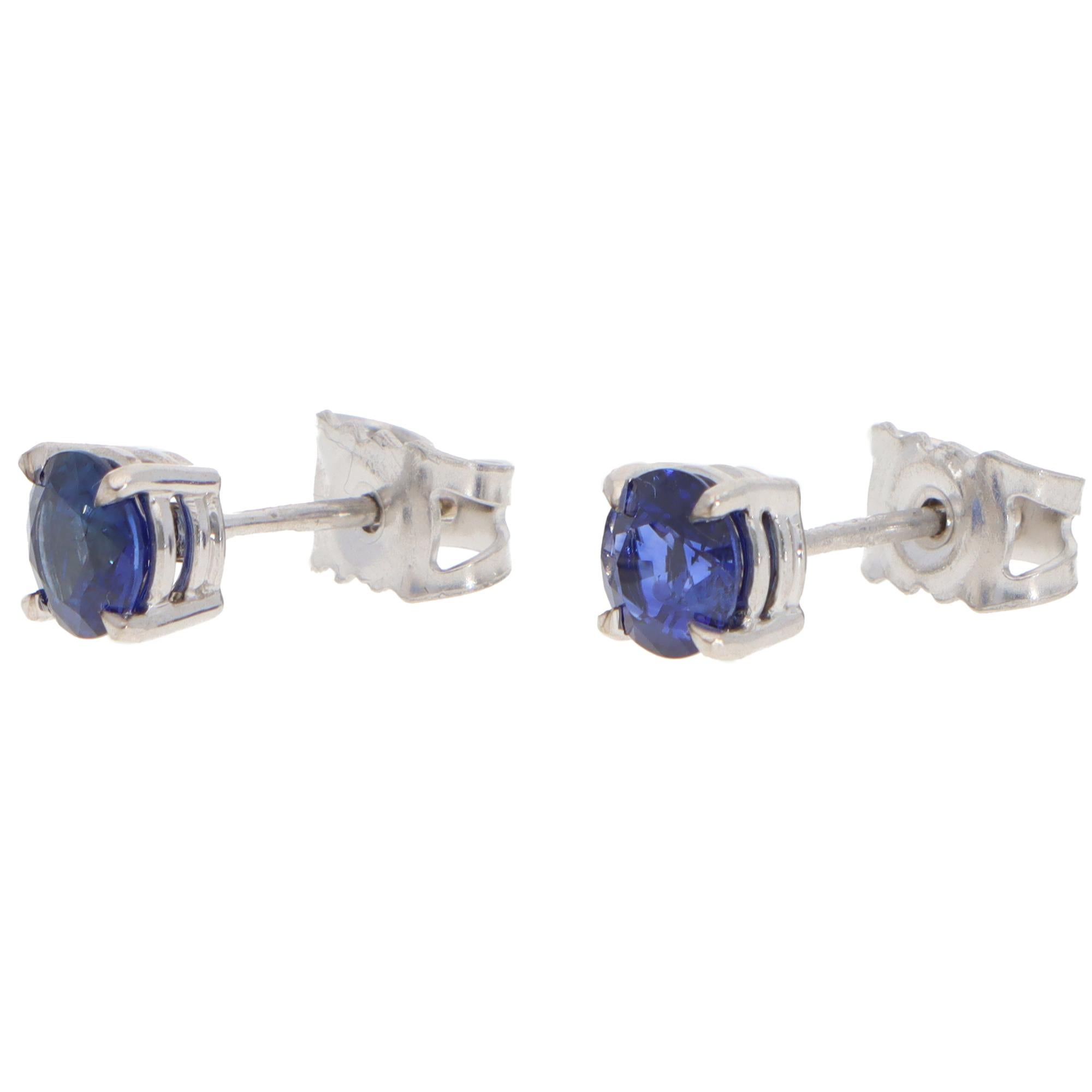An elegant pair of contemporary blue sapphire stud earrings set in 18k white gold.

Each earring is centrally set with a round mixed-cut blue sapphire. The blue colour of these earrings is fantastic, and they look beautiful once worn. The earrings