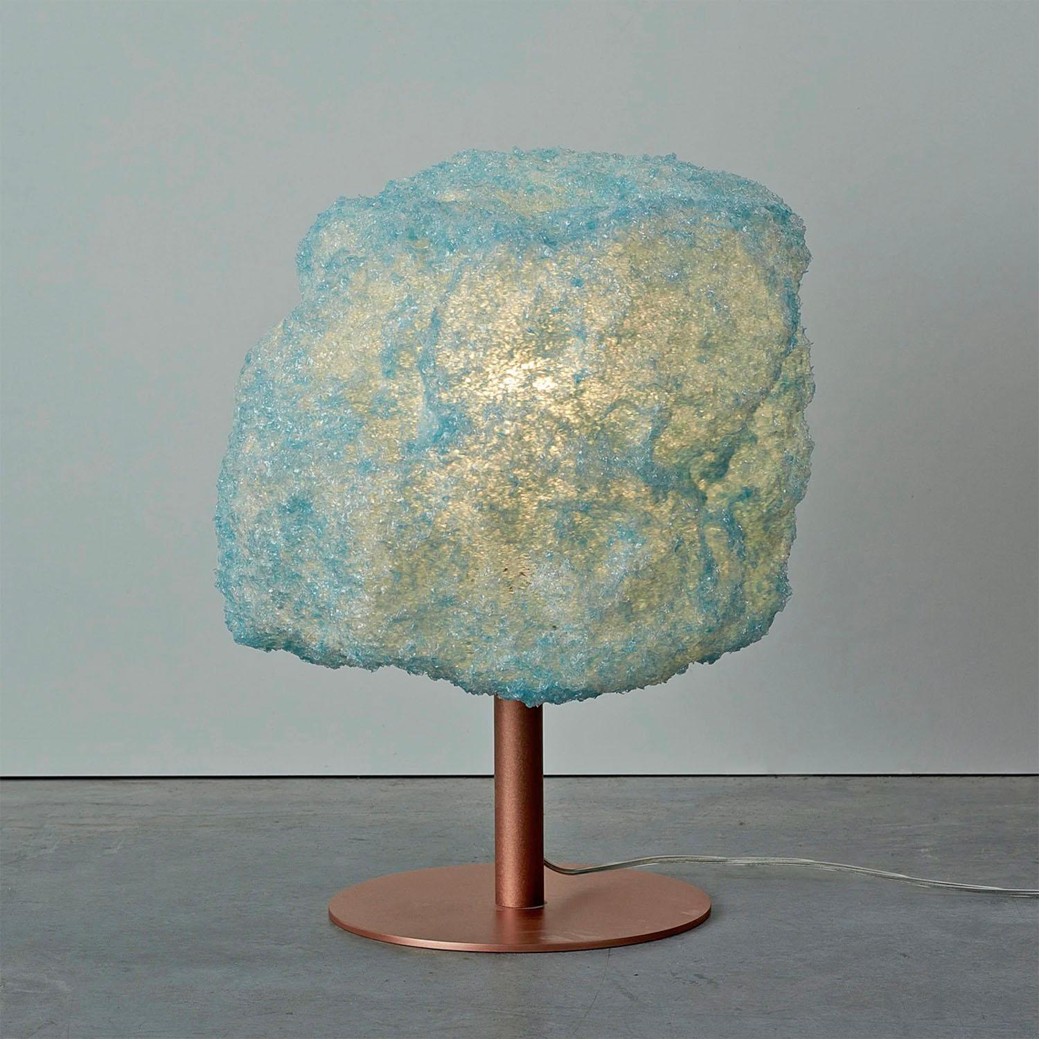 Contemporary blue table lamp - storm light copper by Johannes Hemann
Material: polycarbonate, copper
Dimensions: Ø 38 x H 45 cm
Material options: white, grey, blue

The Storm Series is by its concept the purest example of a process-design, where the