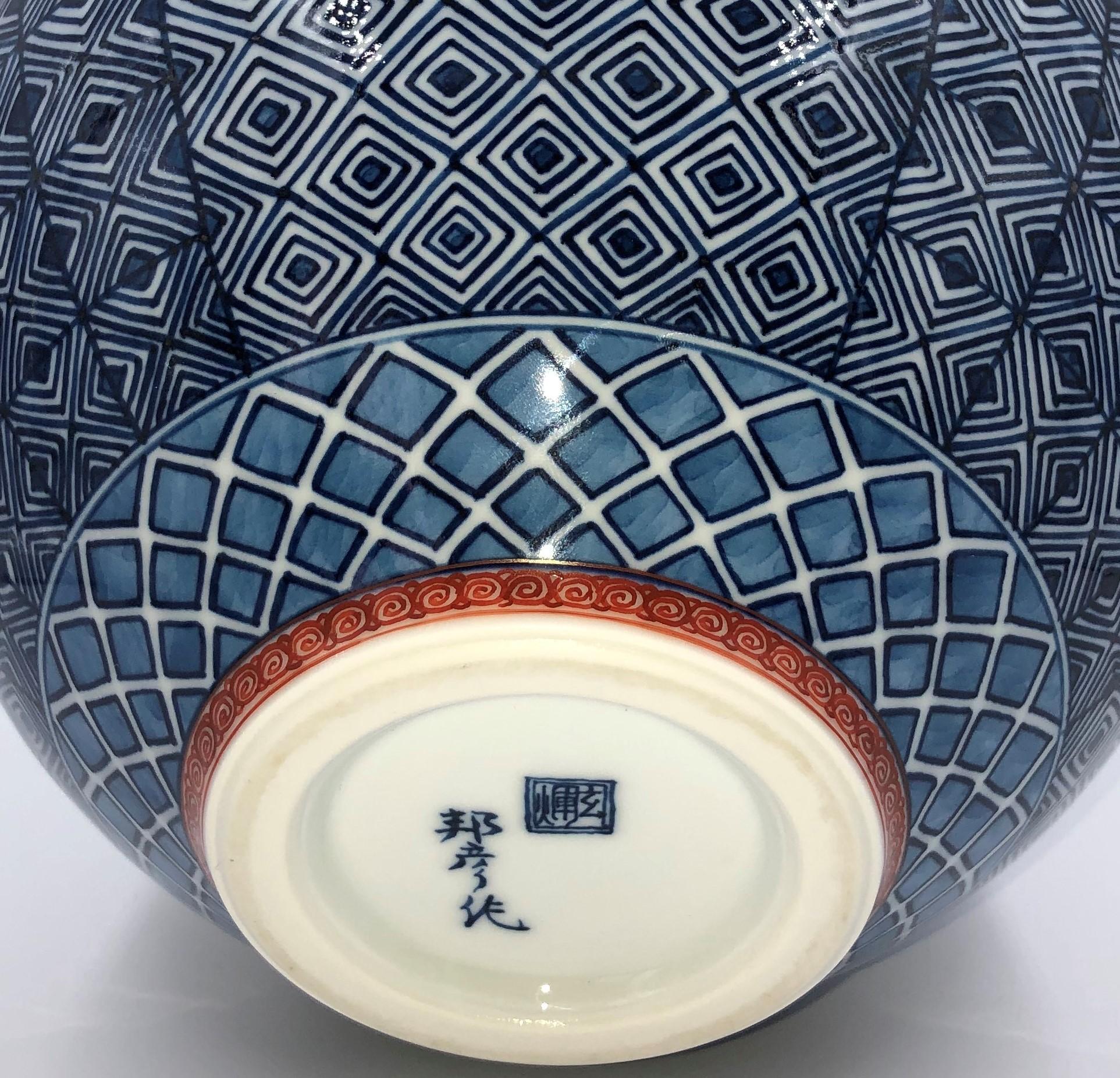 The artist is second-to-none in creating extremely complicated geometric patterns by applying the most sophisticated and demanding techniques of miniature painting to the complex and curved surfaces of porcelain pieces.
This vase showcases two of