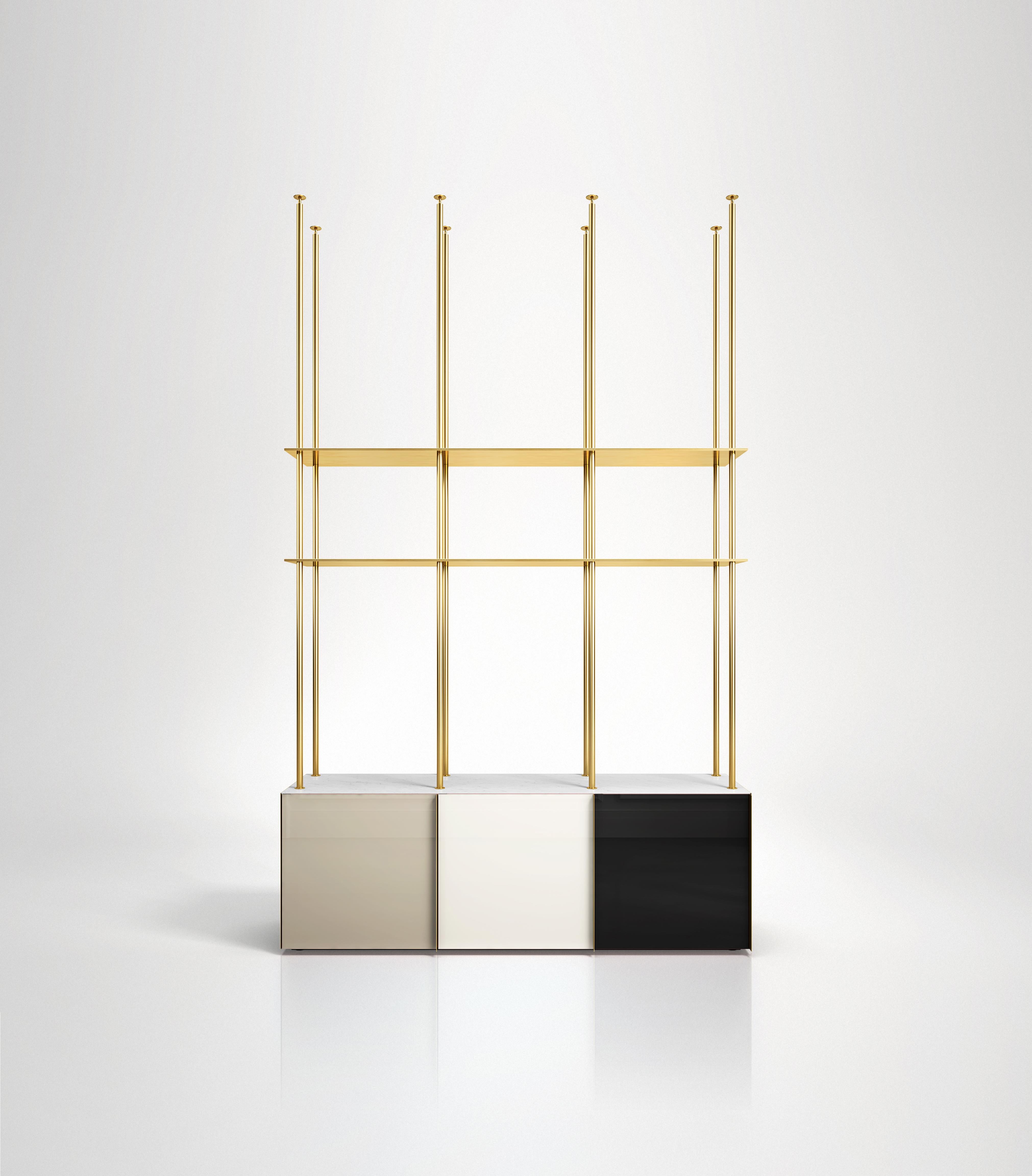 Bookcase 01
Floor to ceiling bookcase featuring 3 back-painted glass doors colored in neutral tones, marble or onyx top, lacquered wooden interior and brass shelving. Each of the three doors has a vertical brass handle and each compartment has an