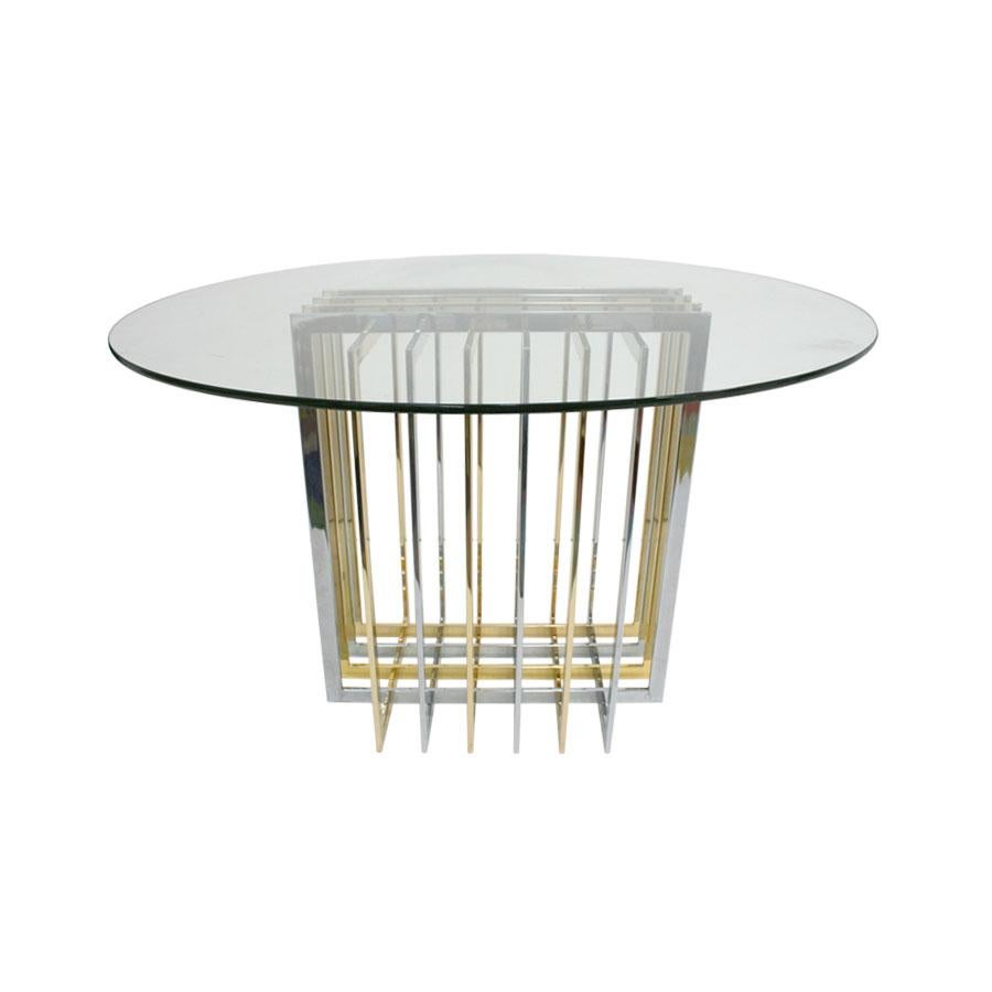 Dining table with structure made of rectangular section tube in steel and brass. Round top made of glass.

Every item LA Studio offers is checked by our team of 10 craftsmen in our in-house workshop. Special restoration or reupholstery requests can
