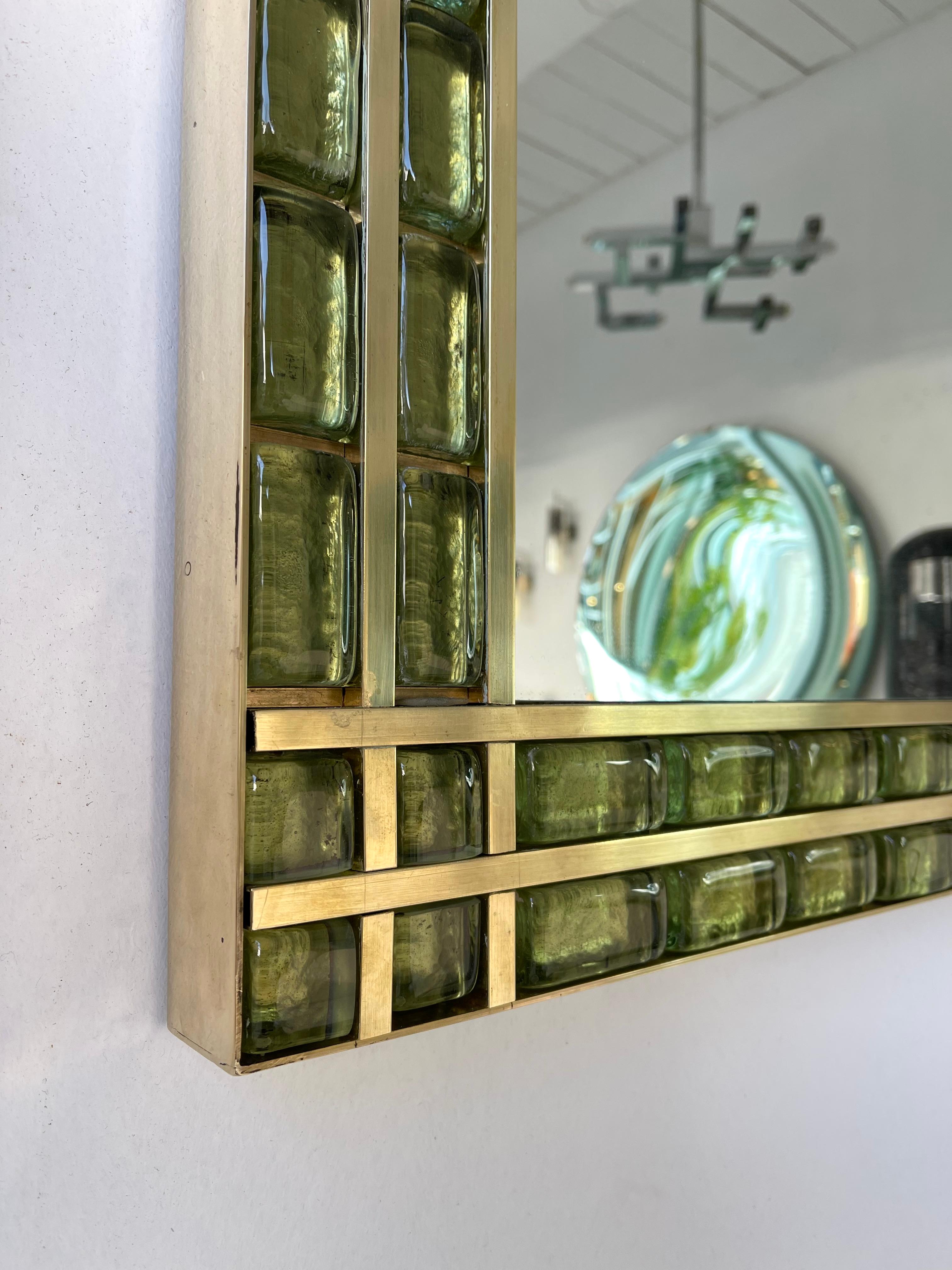 Wall mirror full brass and Murano glass cabochon. Small artisanal production from an italian workshop. Can be hang horizontally or vertically.