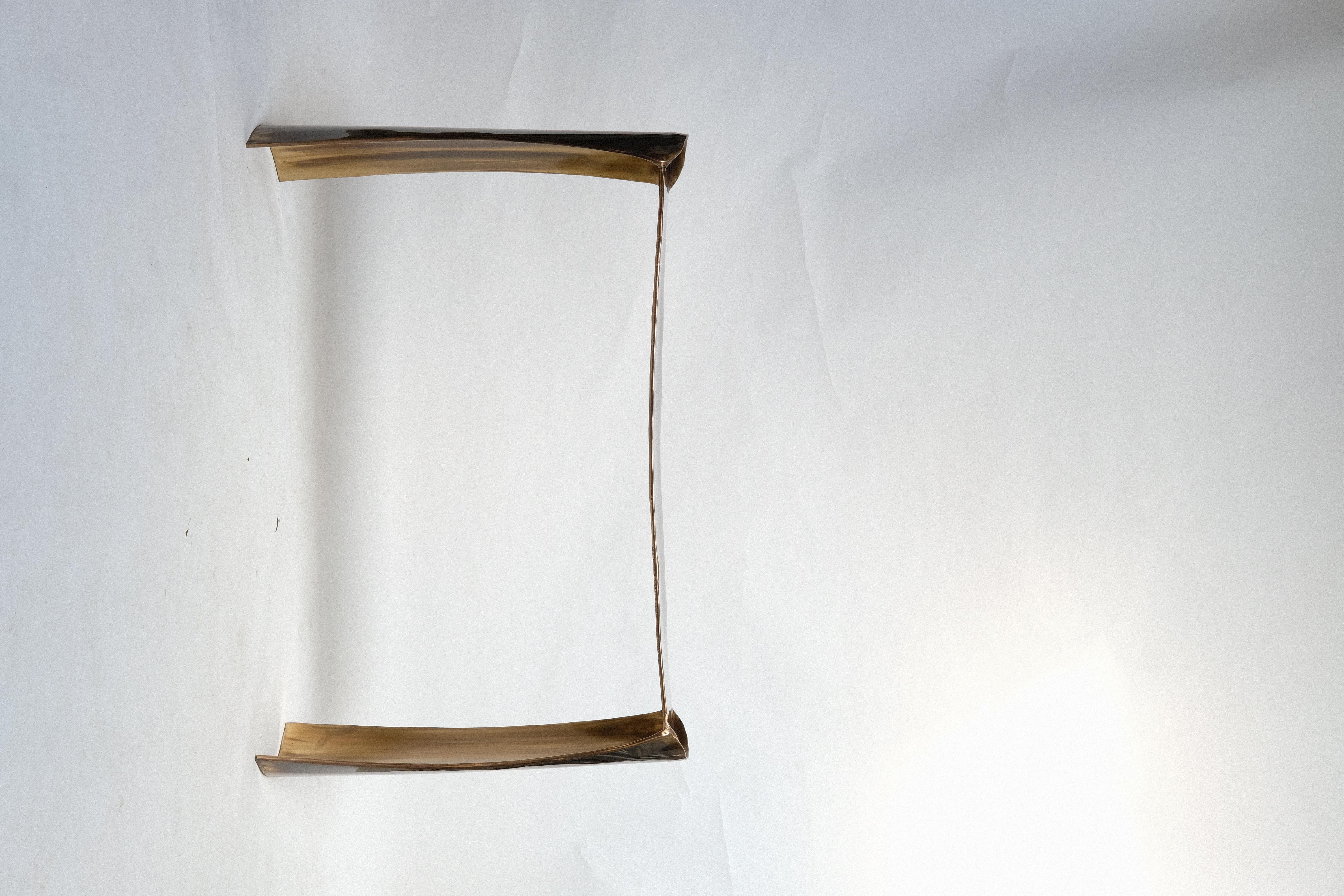 After a beginning as a furnitures restorer in Italy, and more than seven years of experience in metalworking as an assistant of Valentin Loellmann, Christian specialized in merging the fluidity and elegance of materials like steel and brass. His