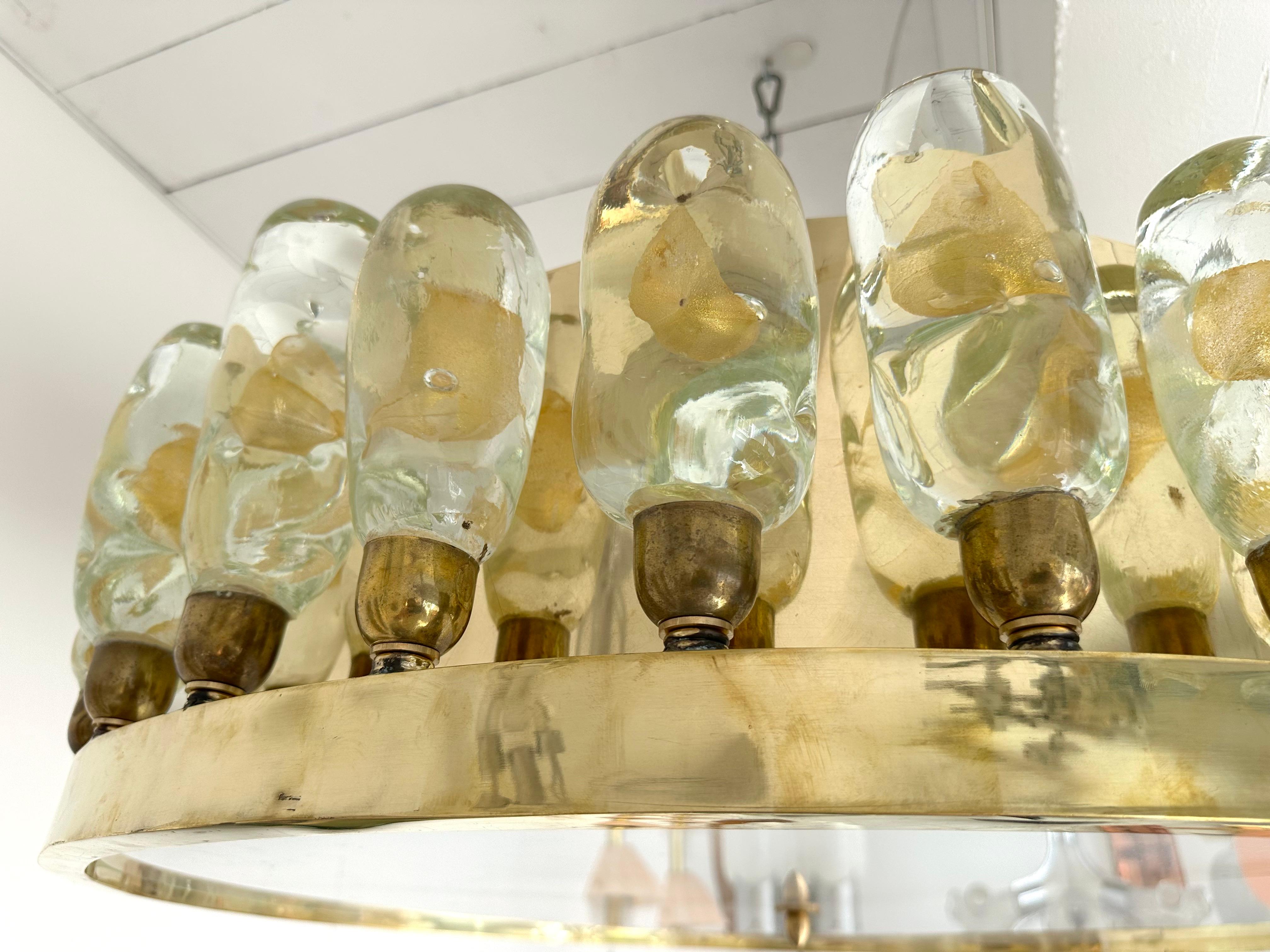 Chandelier ceiling pendant light lightning lamp flush mount in brass and massive Murano glass flame with gold leaf. Contemporary work from a small italian artisanal workshop. Minor imperfections due to handmade artisanal work. In the mood of