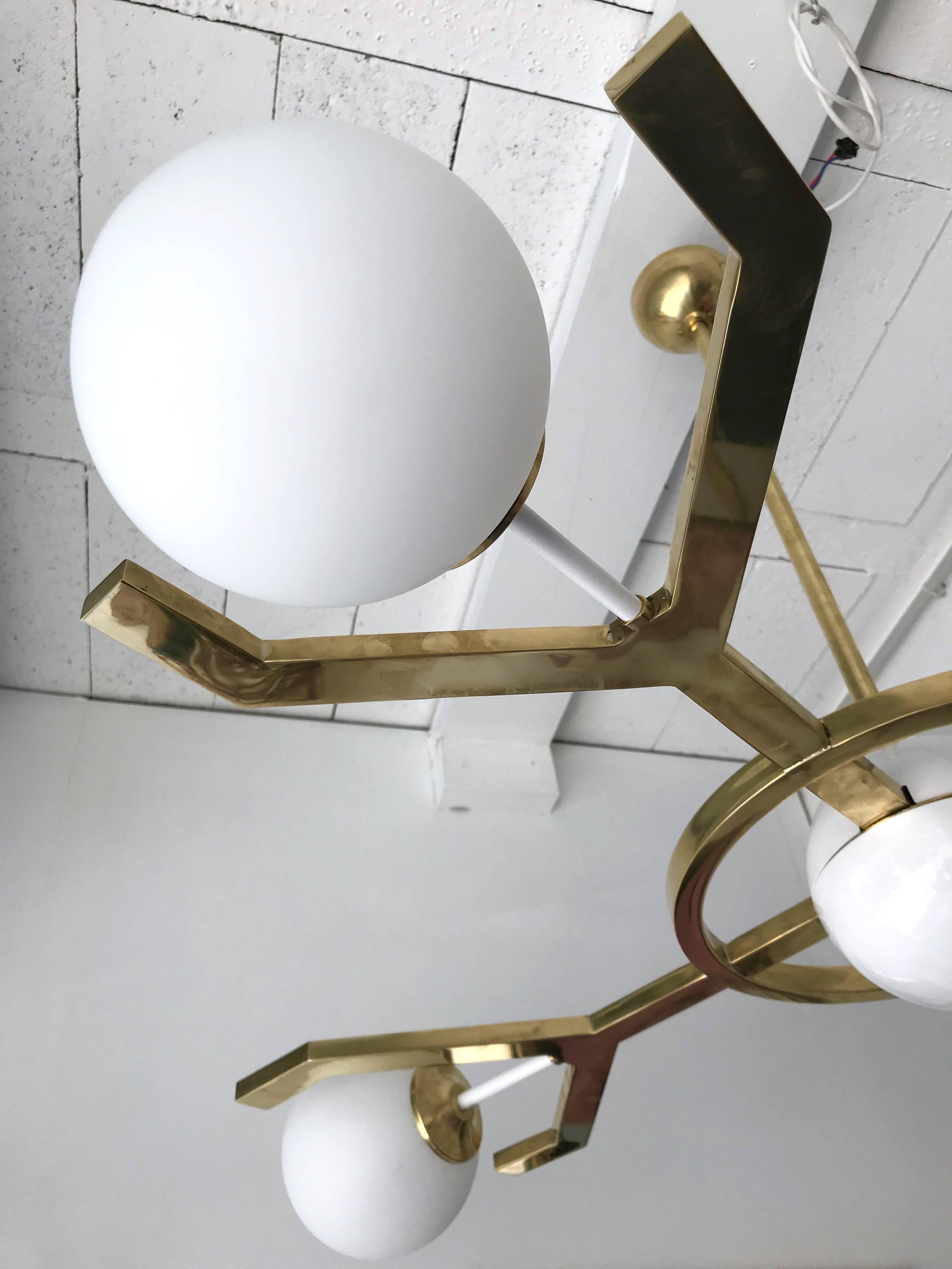 Contemporary chandelier or ceiling pendant light called Y model, full brass and opaline glass ball. Small artisanal production all made in Italy, great quality. Limited edition of 8 exemplary exclusively made for Stanislas Reboul gallery.