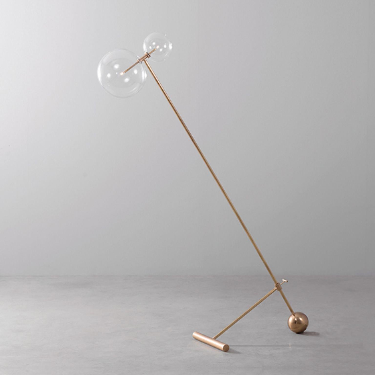 Contemporary brass floor lamp by Schwung
Dimensions: W 25, W D 110 x H 167 cm
Materials: Natural brass, hand blown glass globes
Other finishes available.

Cord 2m with inline on-off switch and plug. Switch location 50cm from the base.
Glass globes