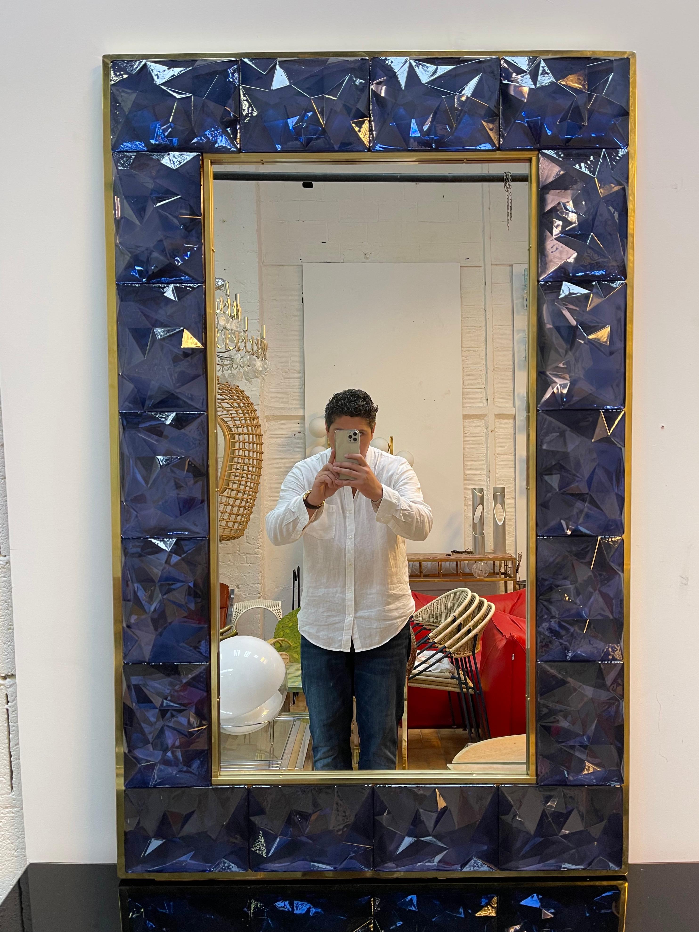 Contemporary wall mirror, full brass and large pieces of blue murano glass with relief diamond point. Small artisanal workshop. The mirror can be hang horizontally also.