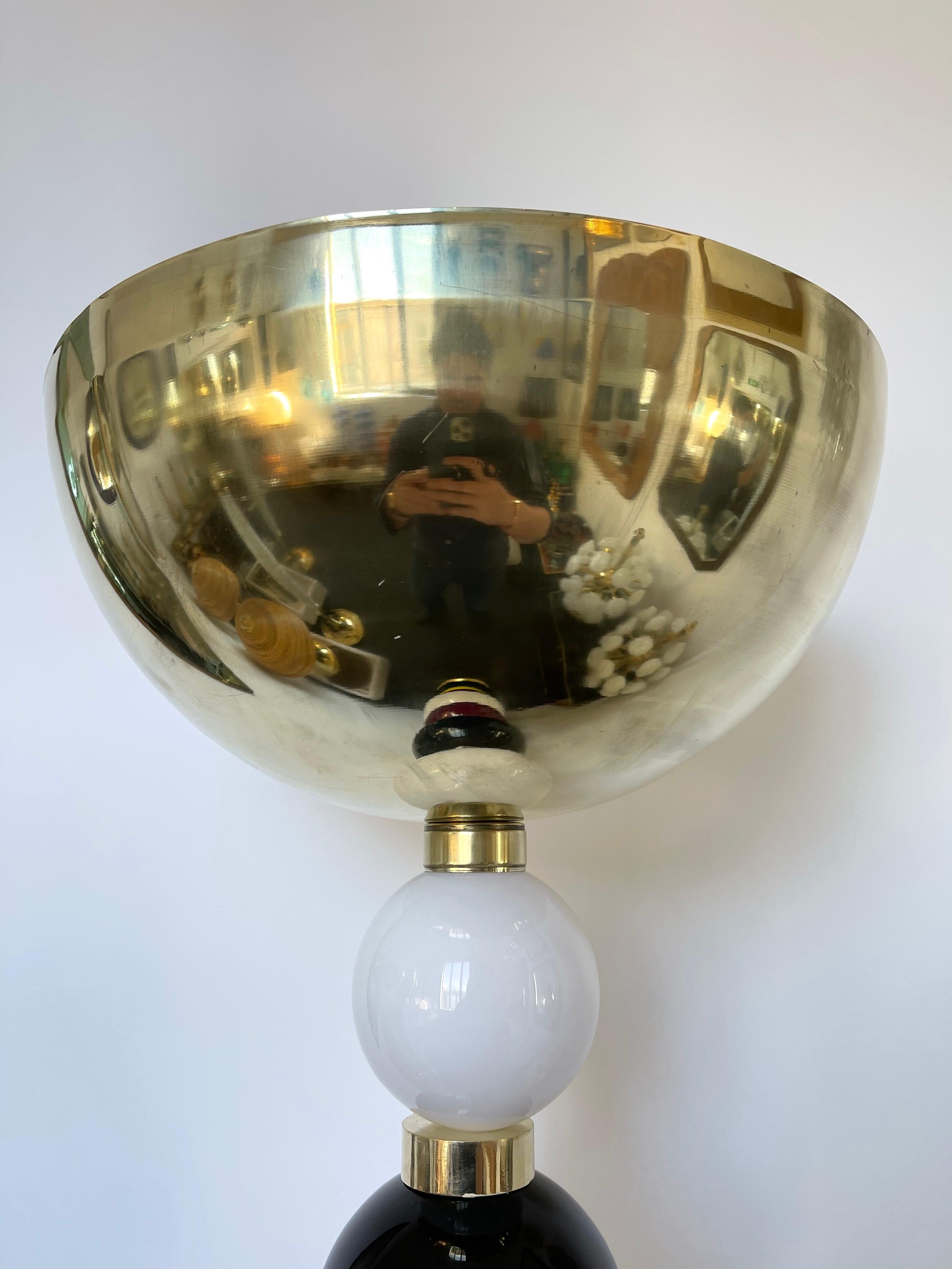 Brass floor lamp with color atomo ball Murano glass, large full brass shade, nice wood detail on base. Contemporary work from a small italian artisanal workshop. In the mood of Venini, Mazzega, La Murrina, Veronese, Seguso, Barovier Toso.

The