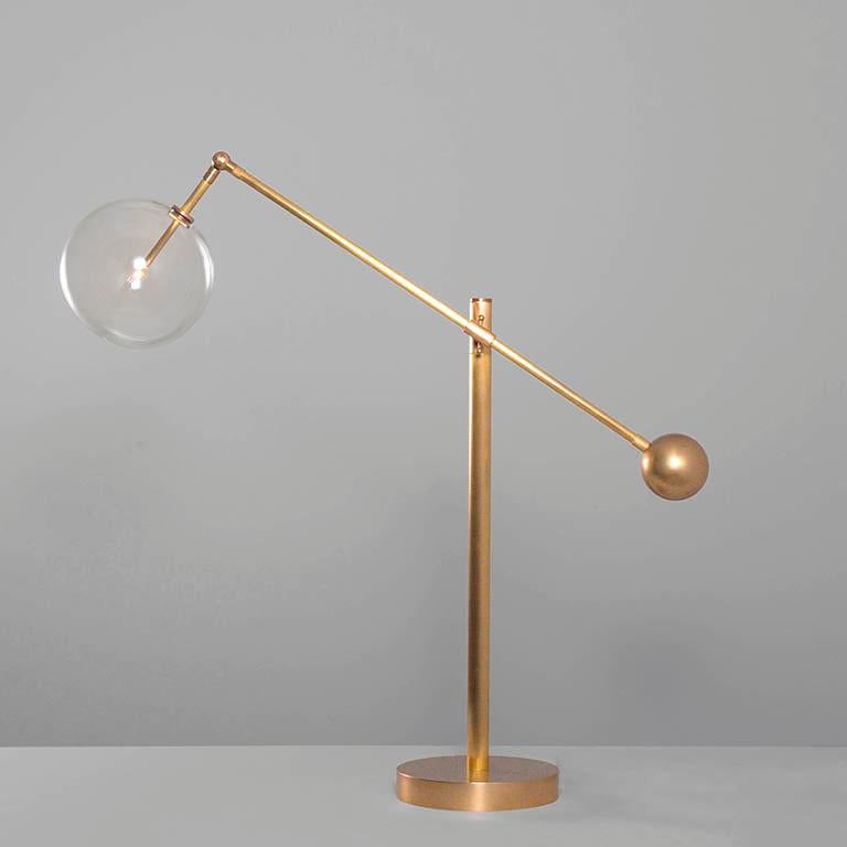 Milan brass table lamp by Schwung
Dimensions: W 26 w D 85 x H 103 cm
Materials: Natural brass, hand blown glass globes
Other finishes available.

Cord 2m with inline on-off switch and plug. Switch location 50cm from the base.
Glass globes diameter