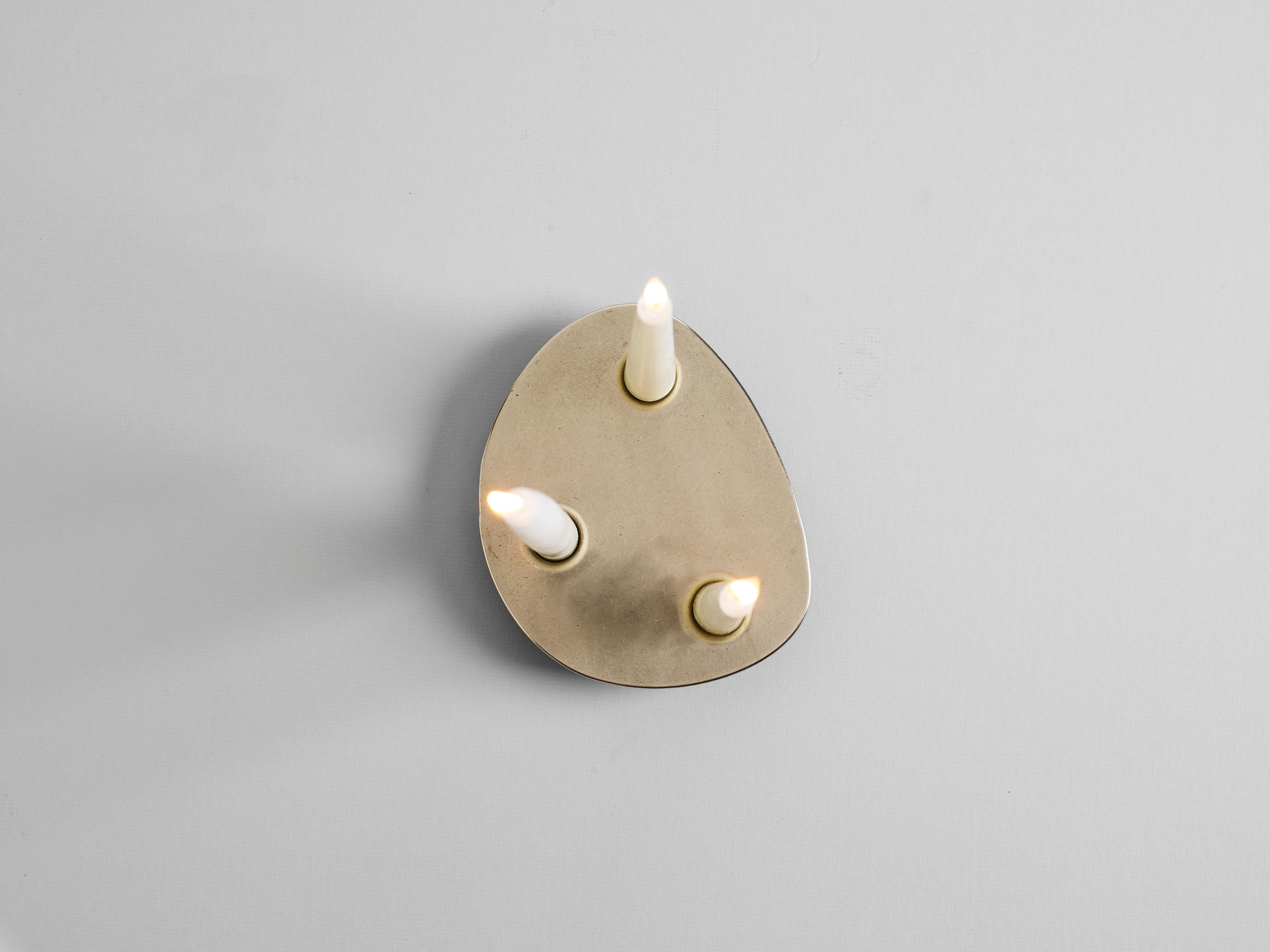 Contemporary brass trio candleholder Henry Wilson

Trio holds three candles in a solid, hand poured, brass form. 

Trio candleholder is manufactured in small batches, slight variations will occur from piece to piece. Production marks may include