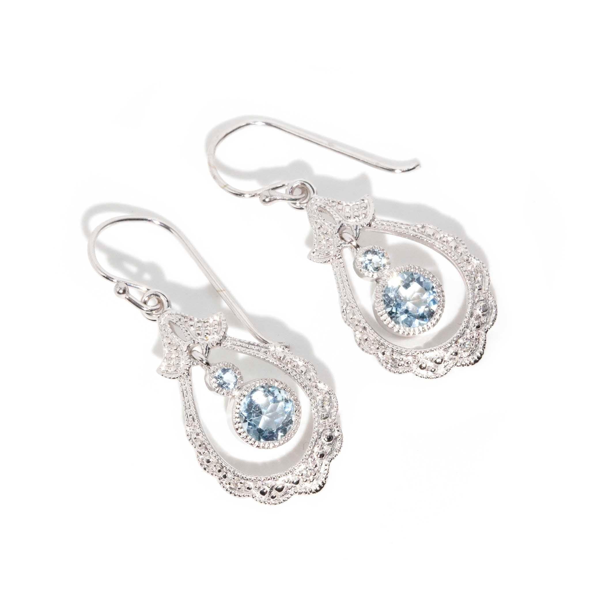 As sweet and delicate as her name may suggest, The Birdie Earrings are a flight of whimsy. Ornately crafted, she is as though lace was woven using white gold thread and finished with the shimmer of blue aquamarines. The stage is set for her