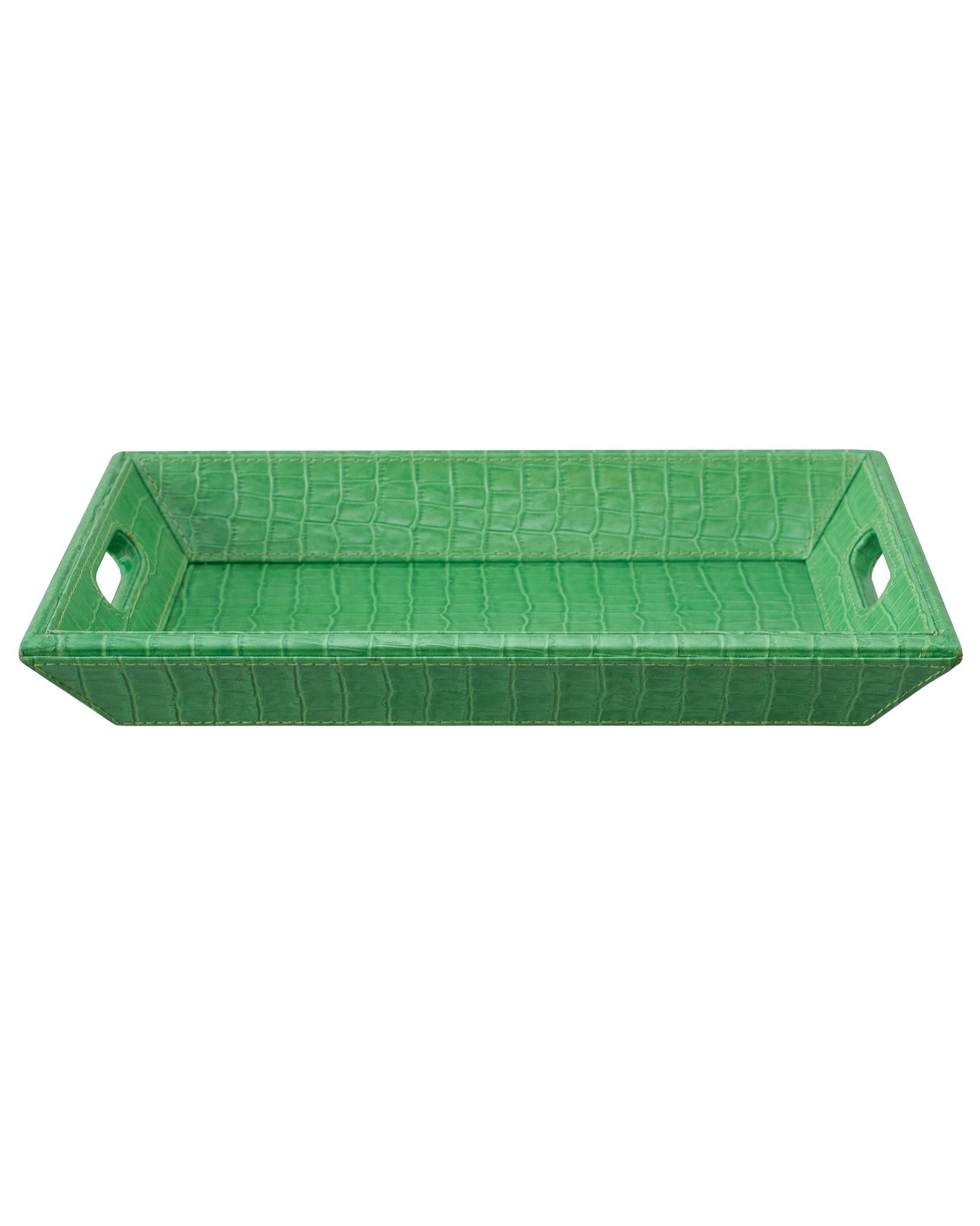 A beautiful bright green crocodile embossed leather tray, perfect for the desk, bedside table, or use as a serving piece. Fully wrapped in embossed leather with stitched panels, each tray has two openings for carrying.