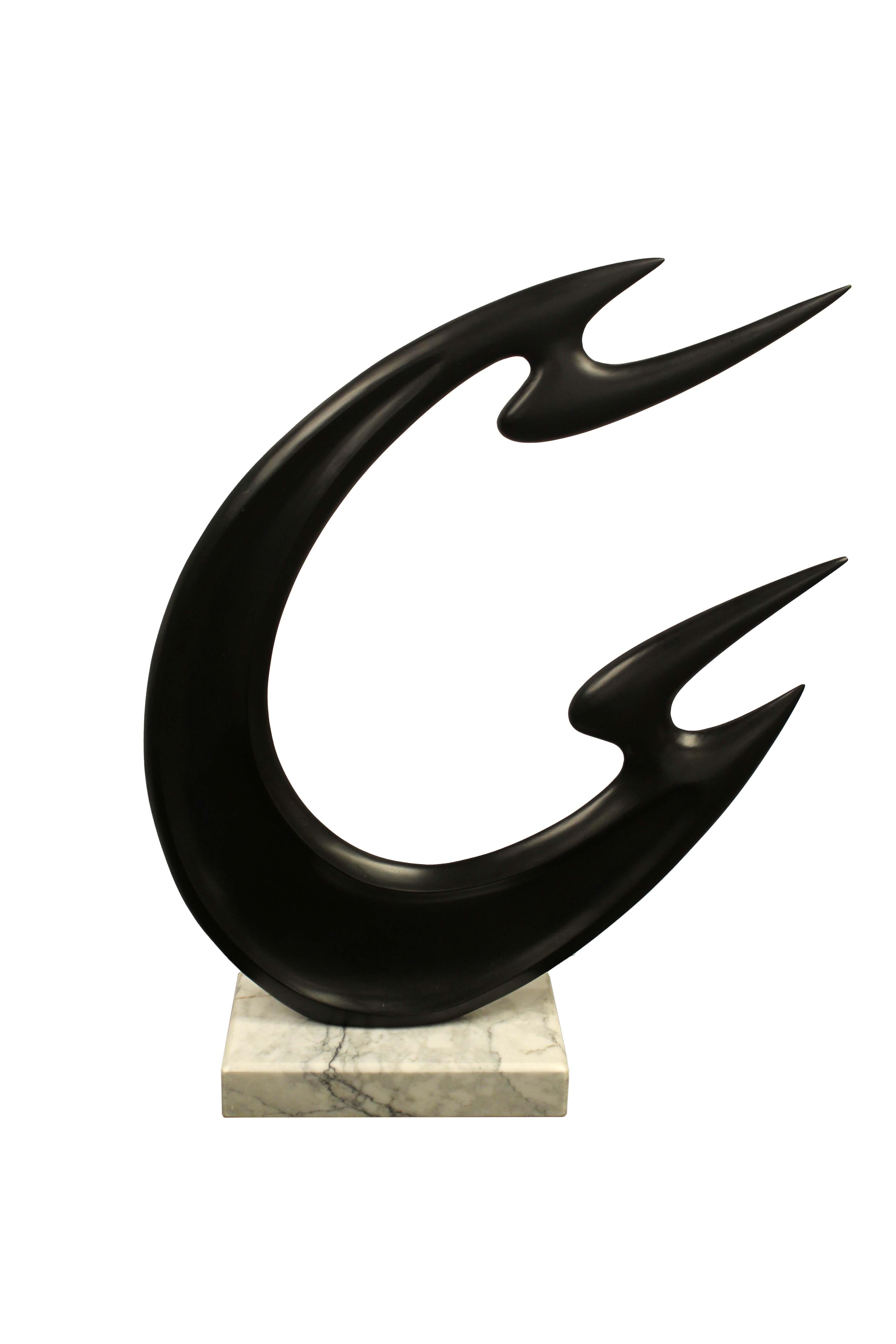 An elegant contemporary bronze sculpture on marble base. The flowing abstract forms adds an element of drama. A marvelous addition to any contemporary designed space. From a private collection. Dimensions: 29 H x 23 W x 7.5 W. In very good
