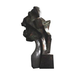 Cabeza cubista contemporánea de bronce
