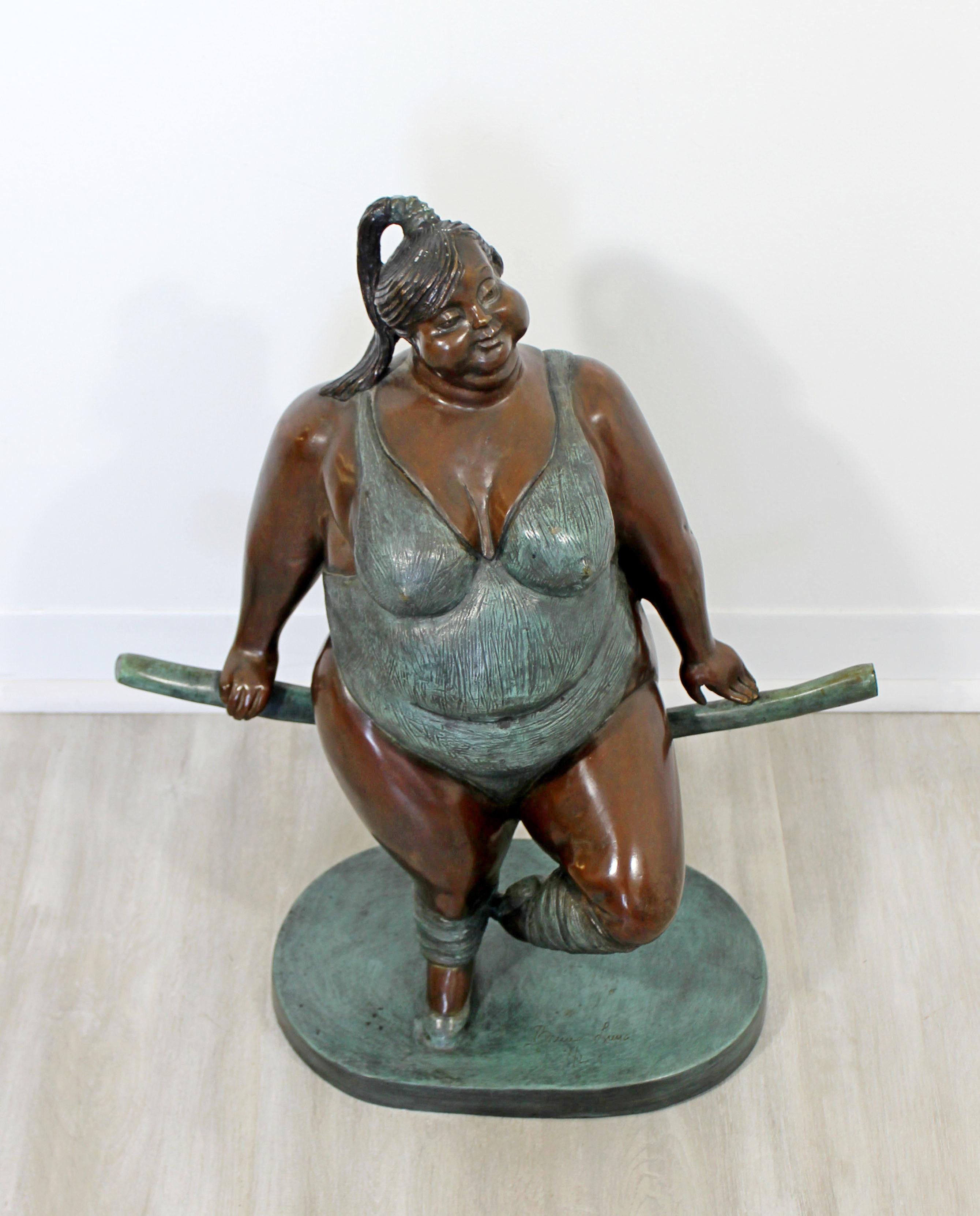 For your consideration is a table sculpture of a voluptuous female gymnast figure, made of bronze, signed Bruno Luna, circa the 1990s. In excellent condition. The dimensions are 18