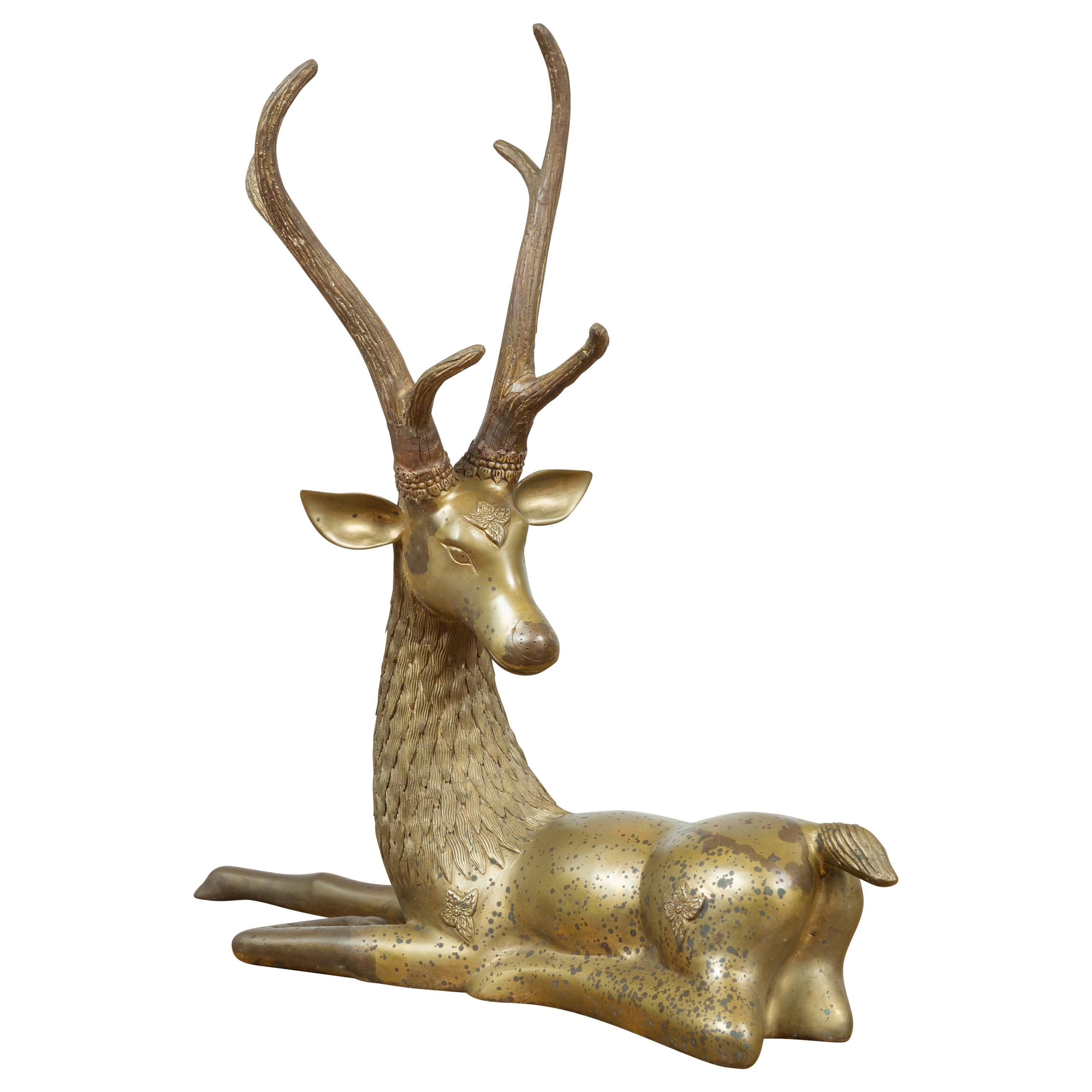 Contemporary Bronze Reclining Deer Statue with Golden Patina and Large Antlers