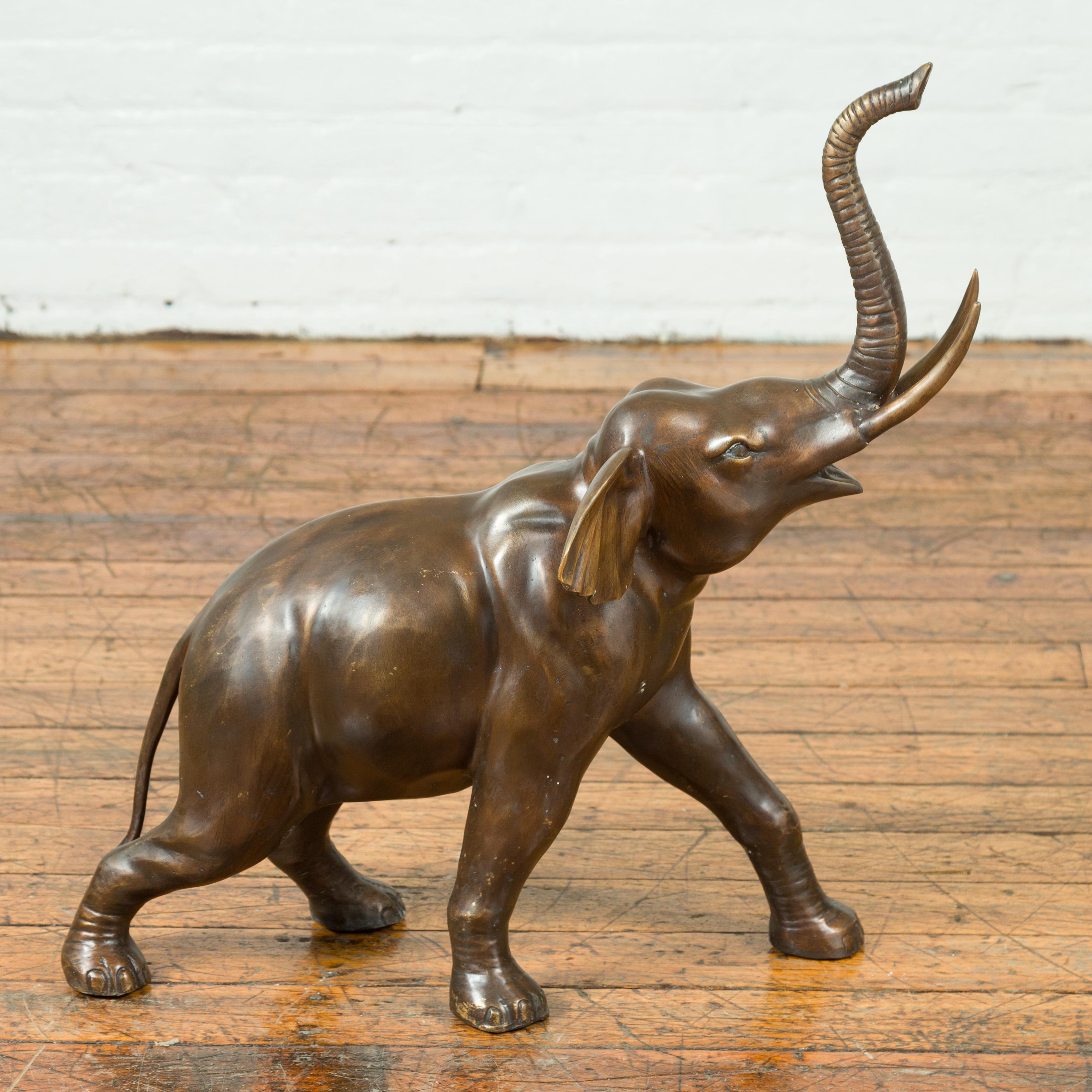 Cast Contemporary Bronze Sculpture of a Trumpeting Elephant with Trunk Up For Sale