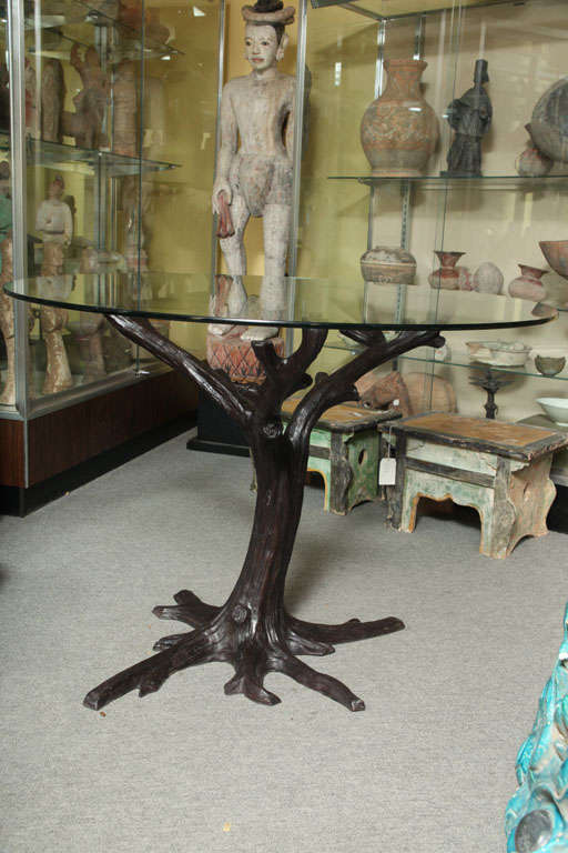 A bronze contemporary tree-trunk shaped dining table base, capable of supporting a top up to 54