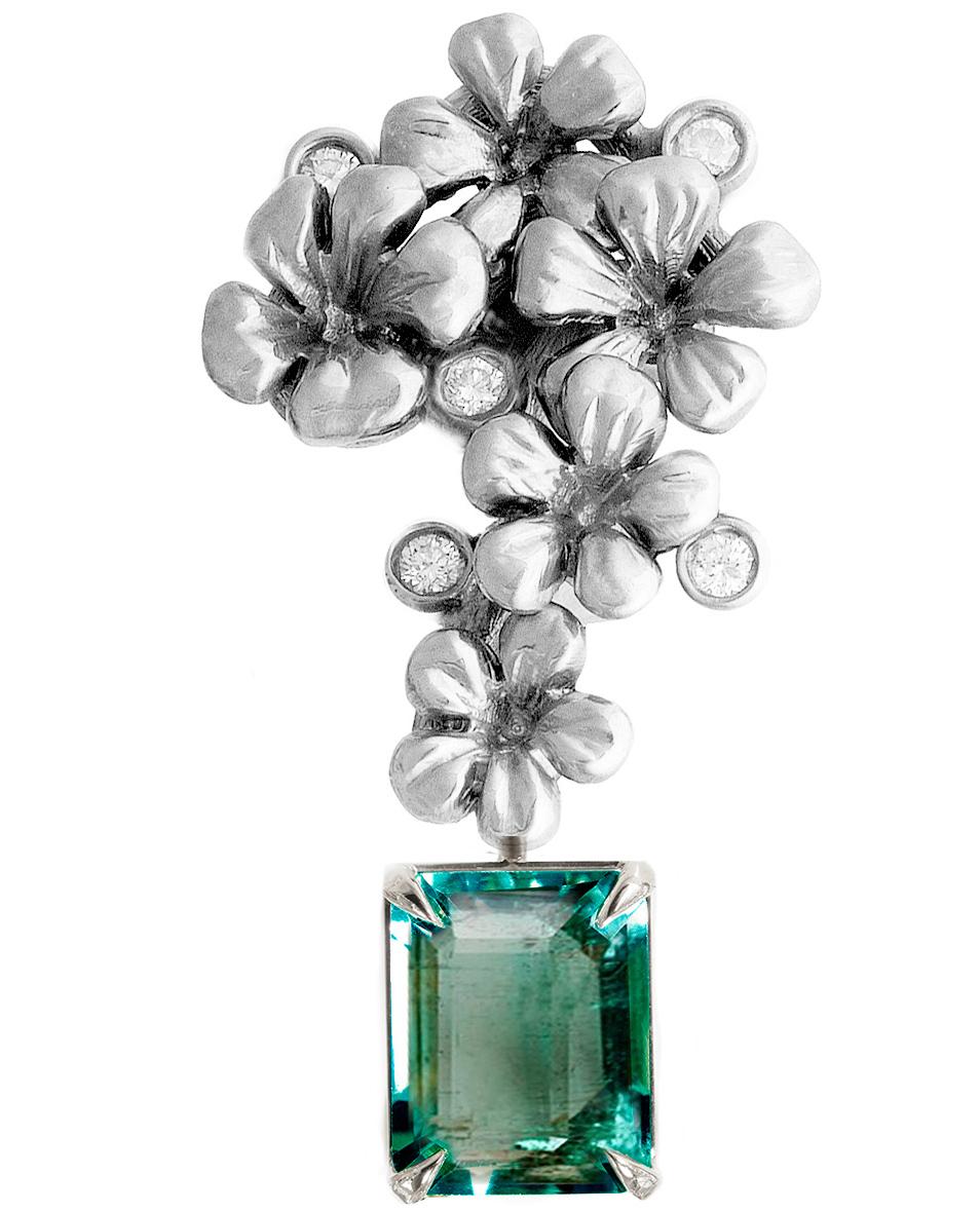 This contemporary 18 karat white gold brooch is encrusted with 5 round diamonds and detachable natural emerald, 1.9 carats, 0.33x0.26 inches. This jewellery collection was featured in Vogue UA review.
The size of the piece is 1.45x0.67 inches, and