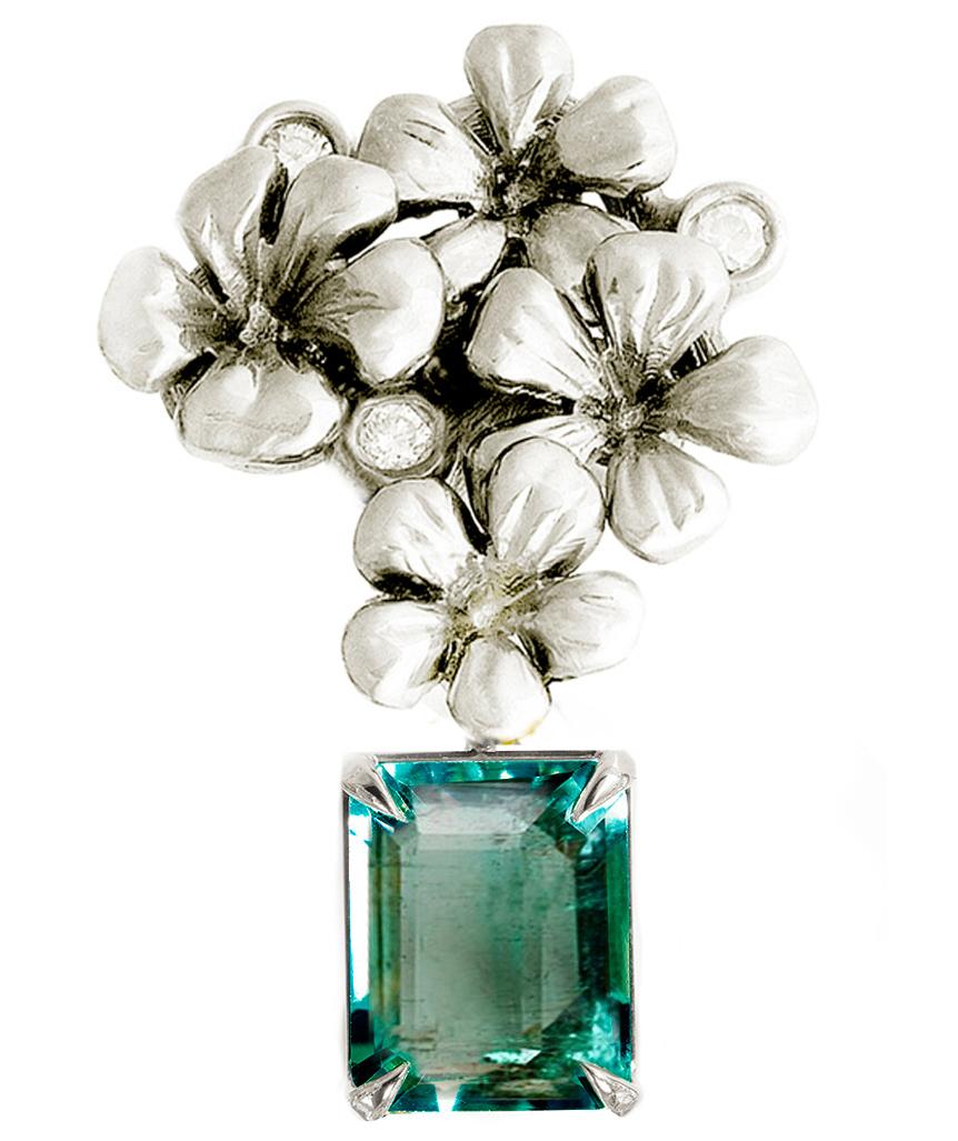 This contemporary 18 karat white gold brooch is encrusted with 3 round diamonds and detachable natural emerald, 1.9 carats, 8.5x6.7 mm. This jewelry collection was featured in Vogue UA review in November. The size of the piece is 3x1.7 cm, and the