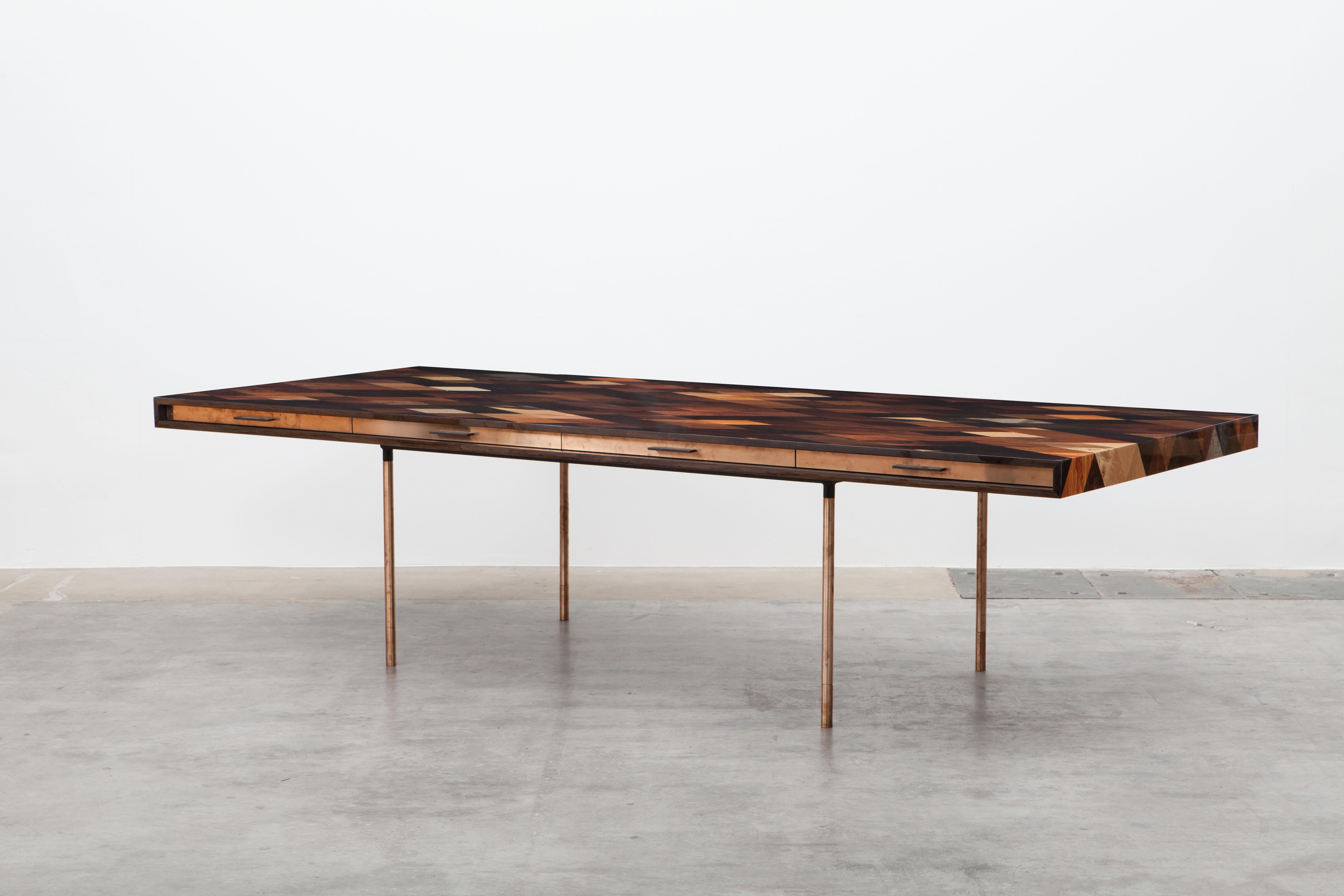 Desk by contemporary artist Johannes Hock, veneered tabletop in diamond pattern with thirty different types of wood. Four drawers on both front sides in bronze. Hidden access to electricity and USB slot under the pattern which can be adjusted to