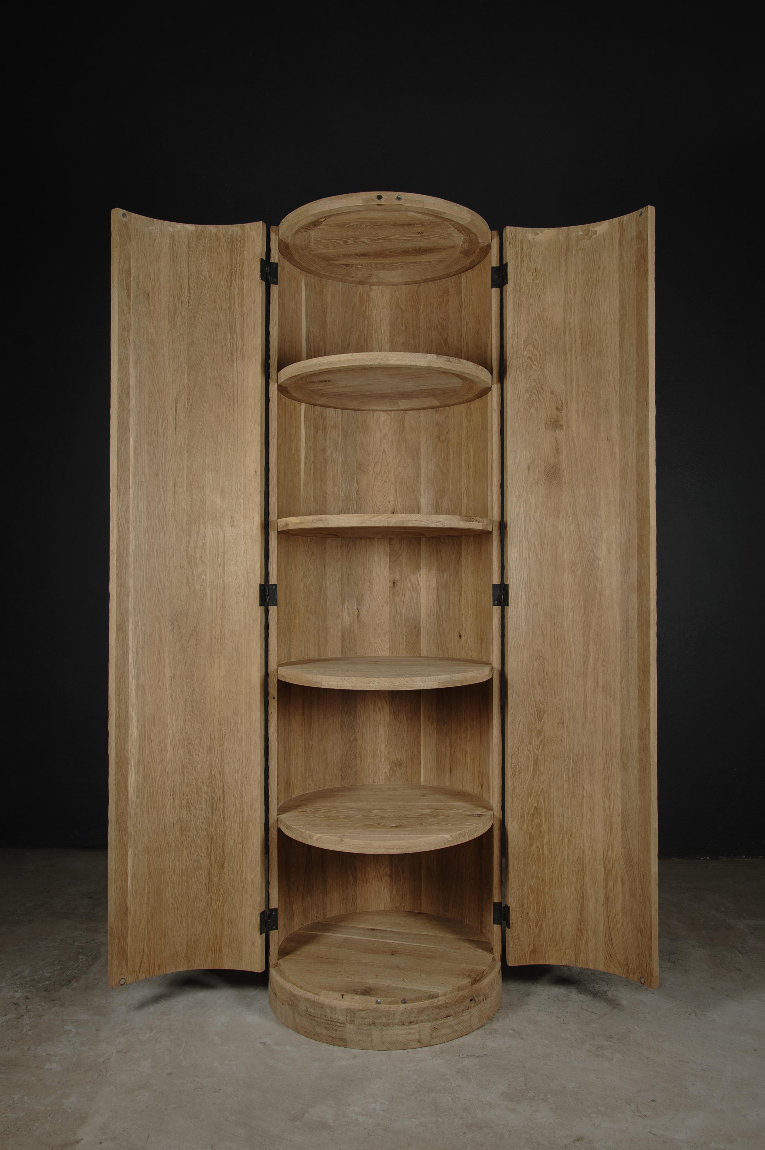Contemporary Brutalist Column Cupboard made of solid oak

Dimensions: 
Height: 182 cm
Diameter: 55 xm

Unique piece made to order. Customizable.

Founded by Denis Milovanov, SÓHA design studio conceives and produces furniture design and decorative