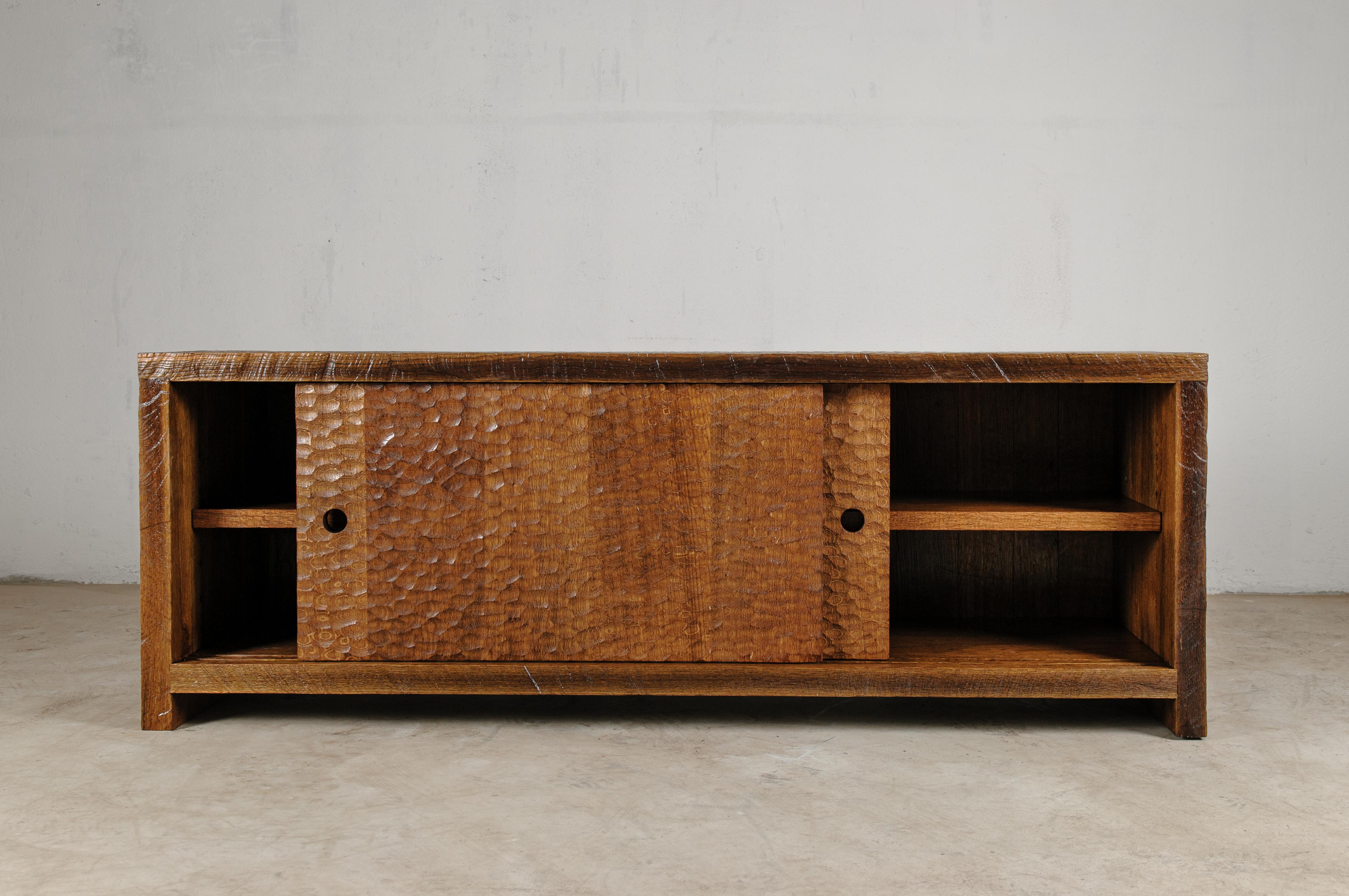 Brutalist credenza in solid oak

Dimensions: 
 H. 50 x W. 160 x D. 45 cm

Unique piece made to order.

Founded by artist Denis Milovanov, SÓHA design studio conceives and produces furniture design and decorative objects in solid oak in an