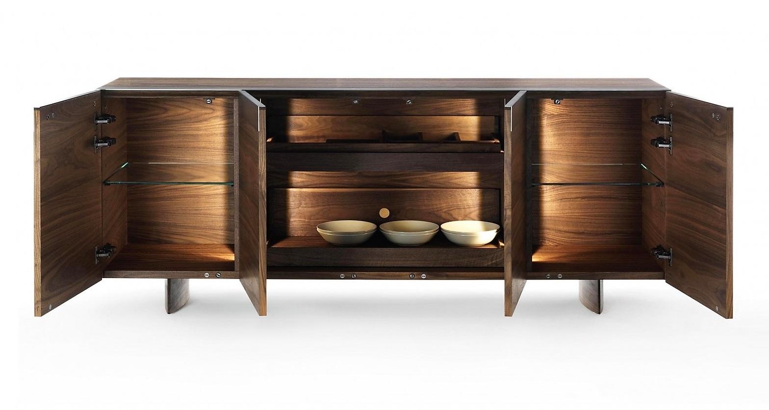 This piece is entirely made in Italy preserving the craftsmanship in the age of technology, with timeless creations which don’t follow short-term trends.
Crafted of solid walnut wood, with doors and pull-out shelves inside. With an original opening