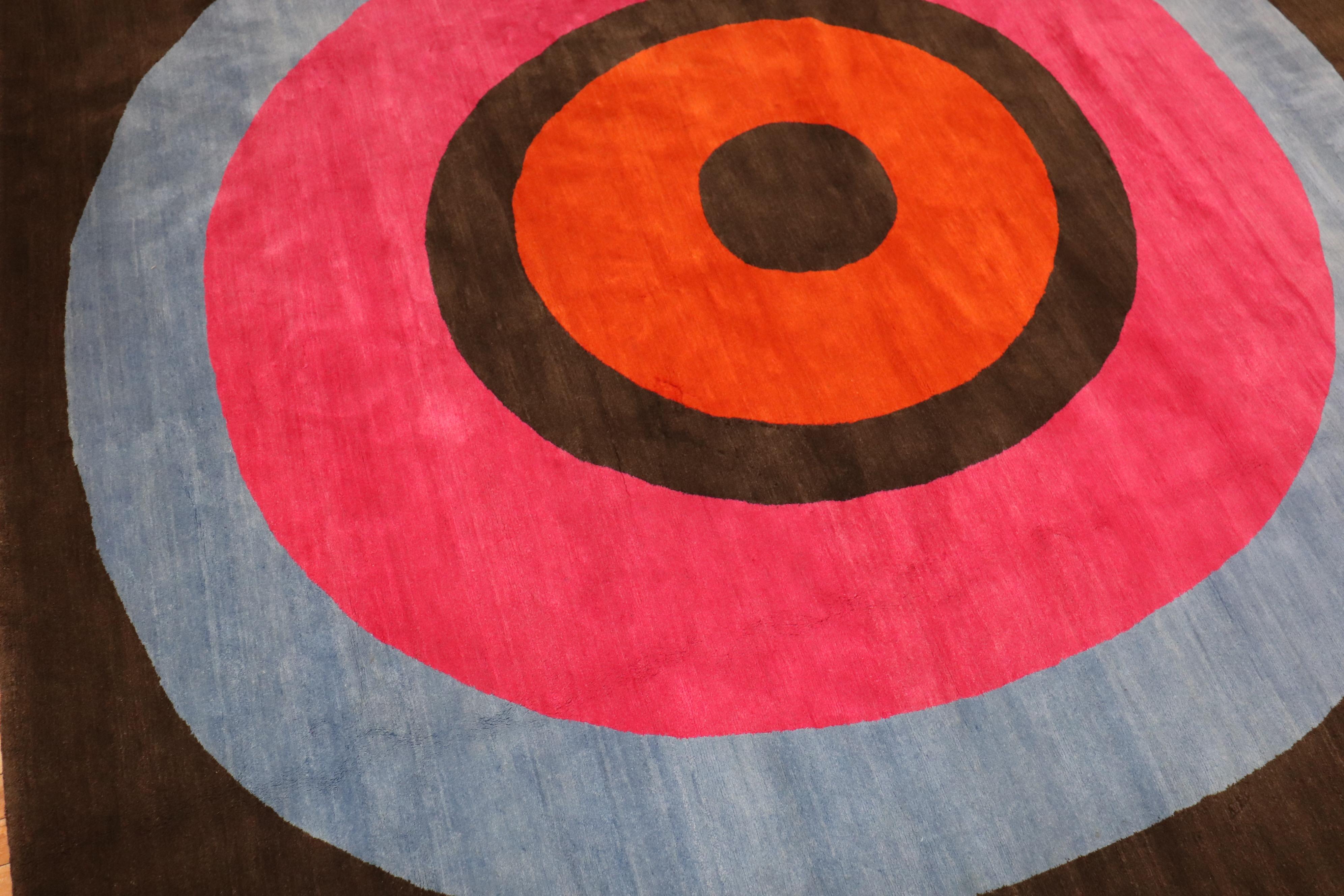 Late 20th-century wool Tibetan carpet with a large off-center bullseye on a brown field

Measures: 11'8