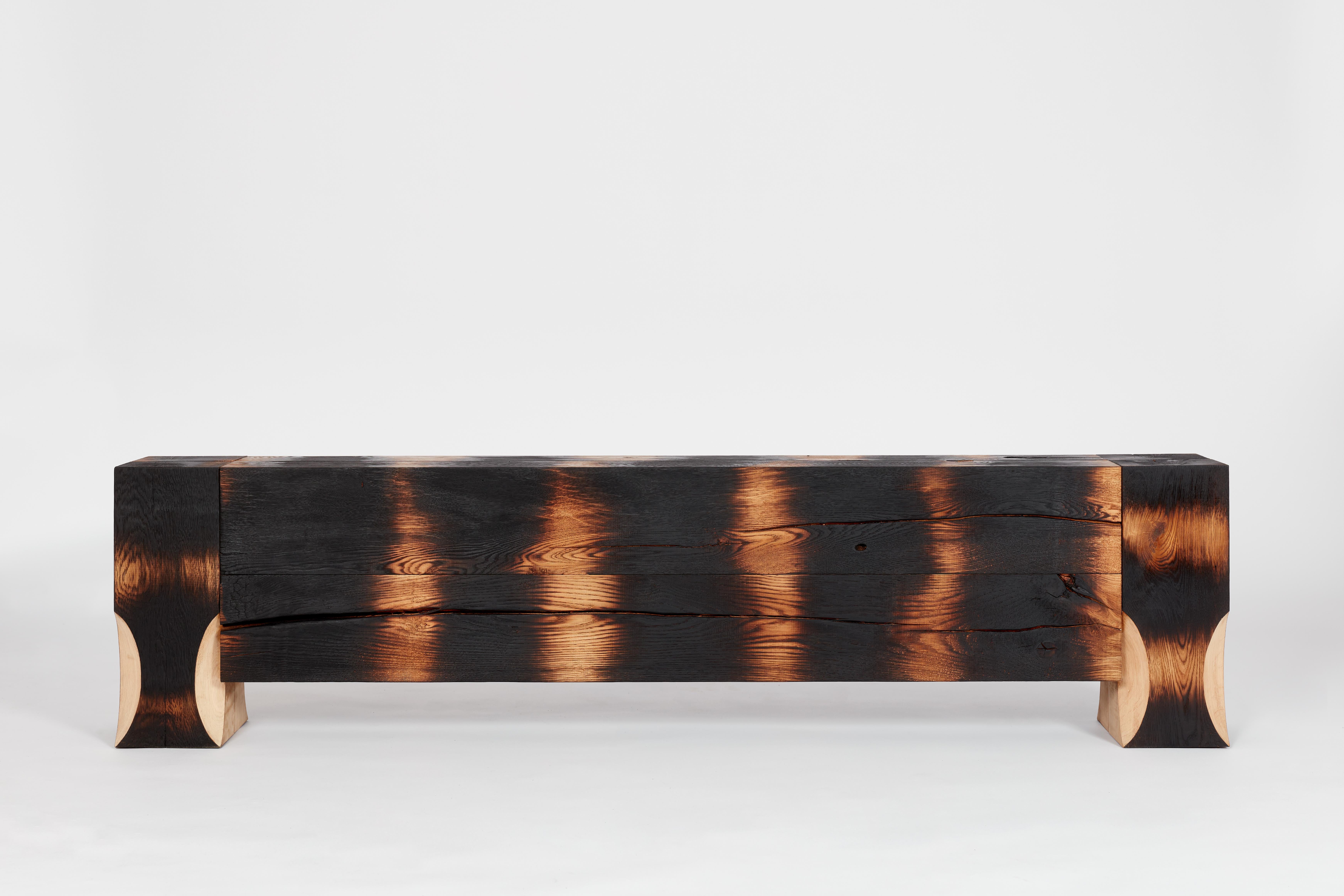 This object is crafted with precision, combining traditional wood burning techniques with the use of solid oak beams. To preserve the intricate wooden pattern and protect it from damage, a meticulous application of seven layers of tung oil is