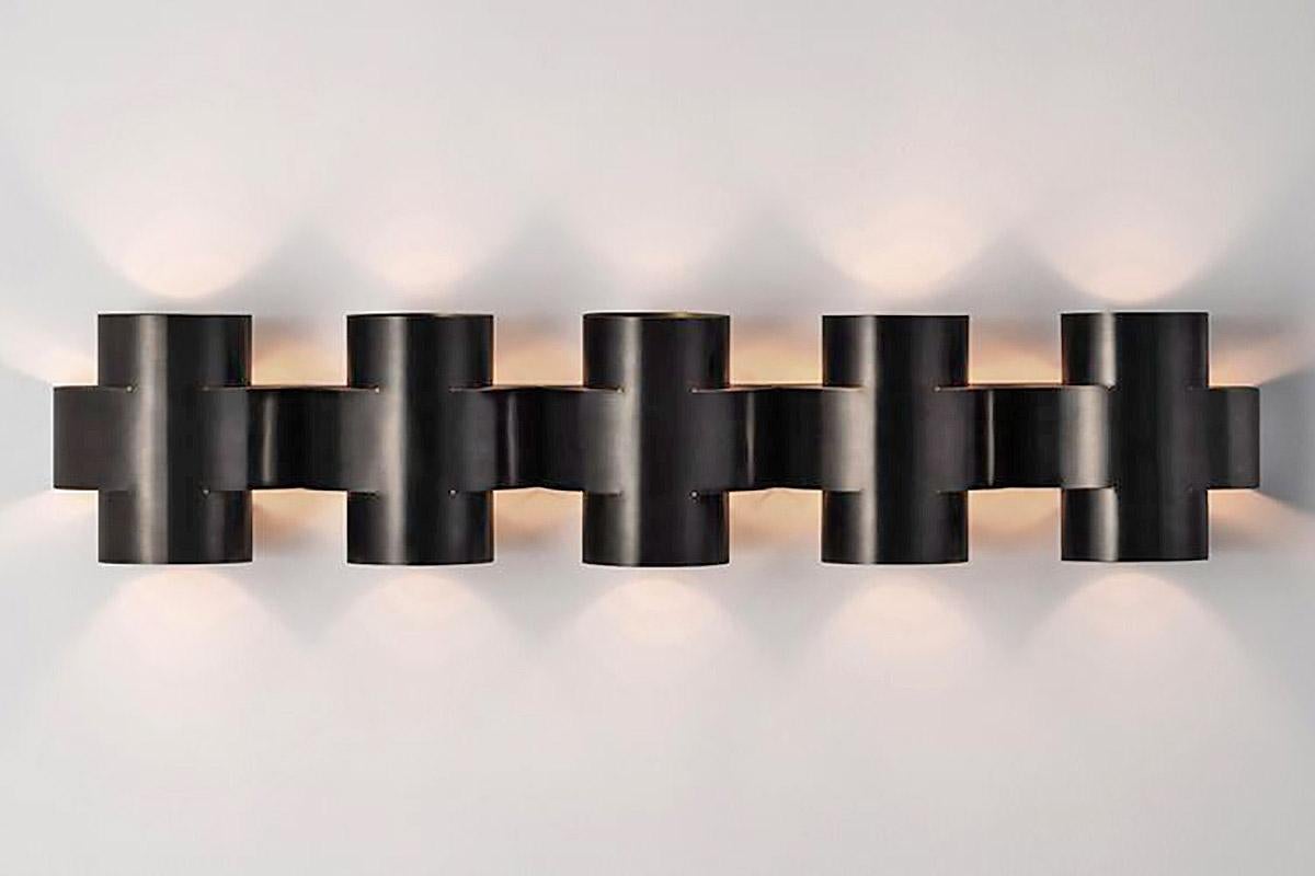 Contemporary Burnt Brass Wall Sconce, Plus Five Appliqué by Paul Matter

PLUS Series is a new range of appliqués by Paul Matter that feature a simple shape in singular and repetitive arrangements. A 3-Dimensional plus is formed out of a single tube
