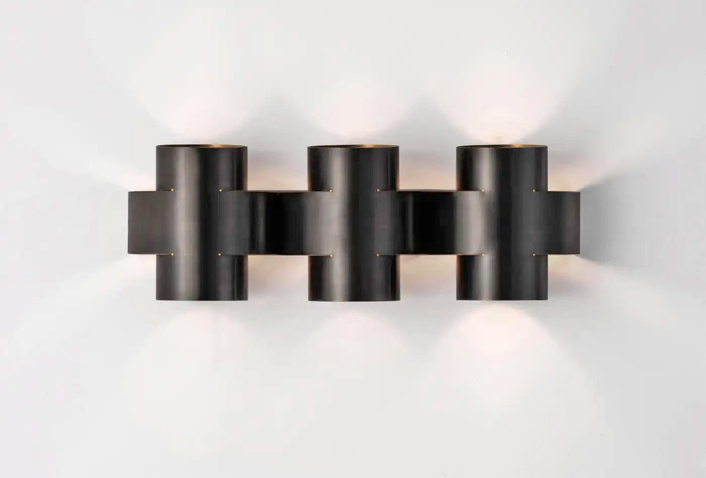 Contemporary Burnt Brass Wall Sconce, Plus Three Large Lamp by Paul Matter

PLUS Series is a new range of appliqués by Paul Matter that feature a simple shape in singular and repetitive arrangements. A 3-Dimensional plus is formed out of a single