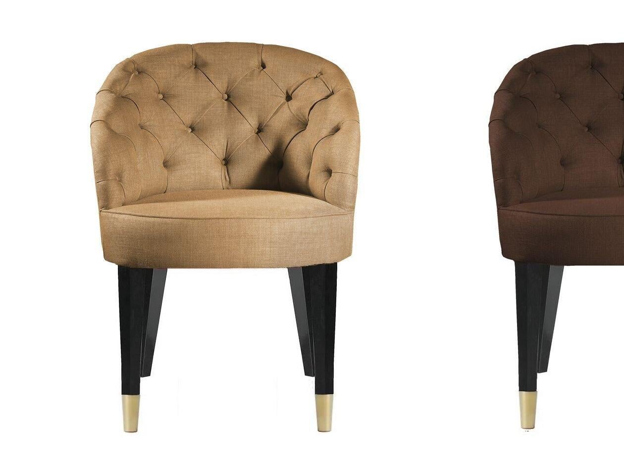 Timeless design featuring tufted back and solid wood legs in ebony finish. 
Upholstered in performance woven fabric in variety of colors.
Optional frontal legs metal caps in brass finish.
Available in other wood finishes and lacquers.
COM available