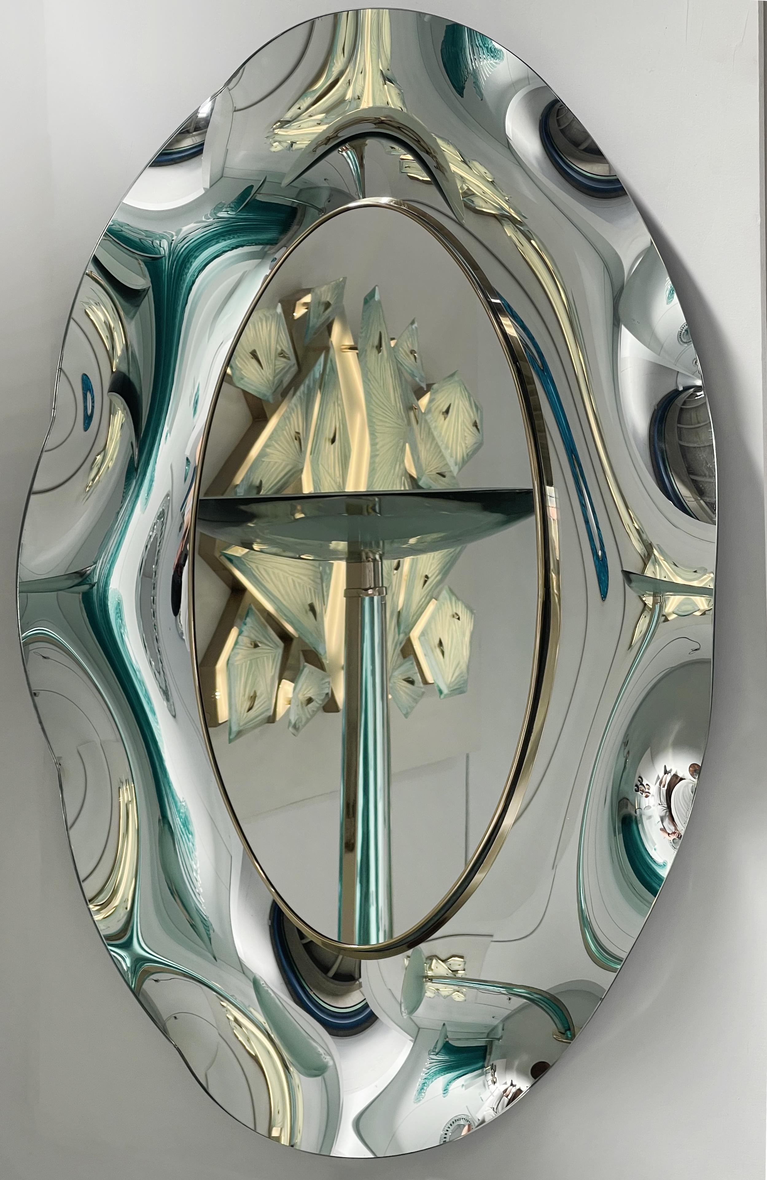 
The 'Undulate' wavy mirror is perfect synthesis of timeless style, innovative design and italian craftsmanship excellence. The crystal has been hand-worked and expertly curved by the artist.
The support structure is made of wood and brass. The